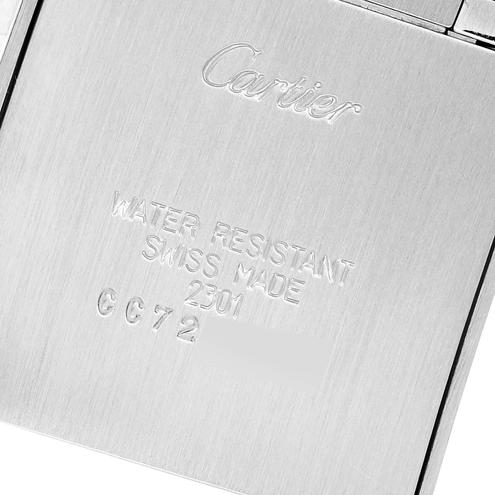 This image shows the back of a Tank Francaise watch by Cartier with inscriptions and serial numbers.