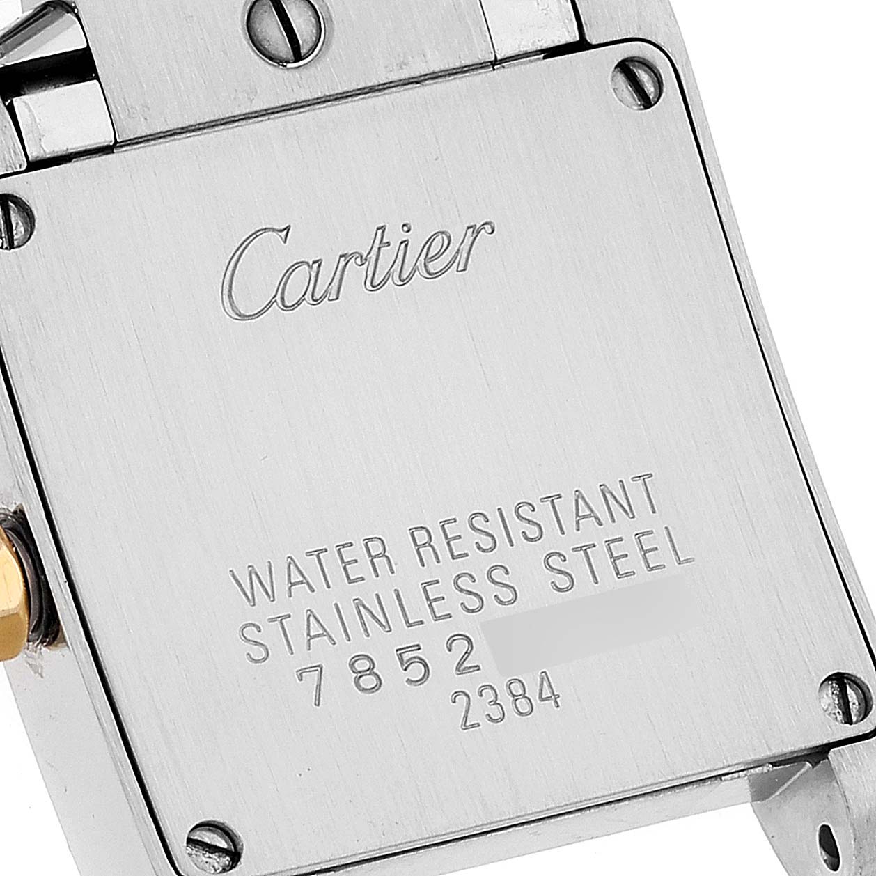 The image shows the back panel of the Cartier Tank Française watch, highlighting the brand name, material, and water resistance.