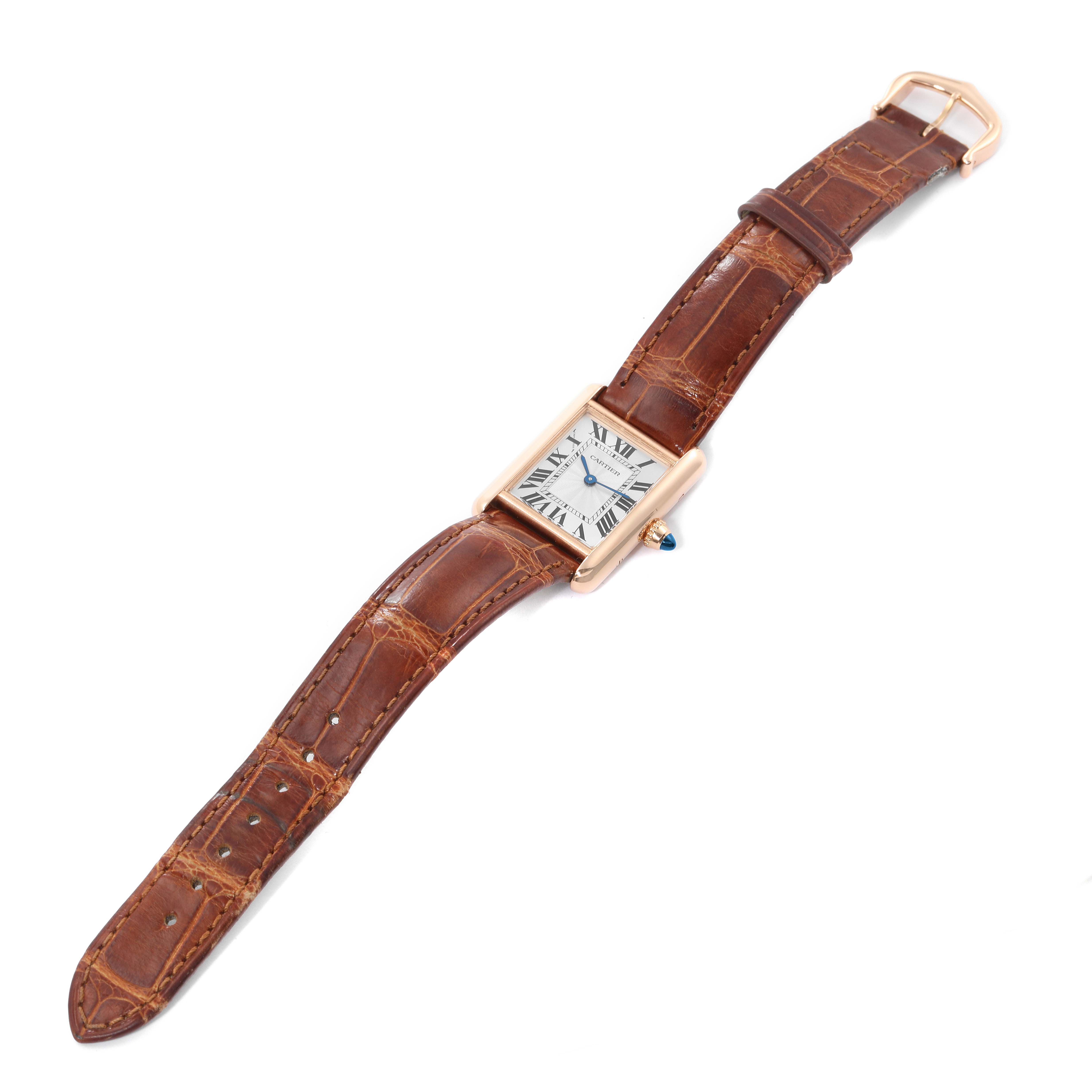 The image shows a Tank Louis model by Cartier, featuring a front view of the watch with a brown leather strap, rectangular dial, and gold casing.