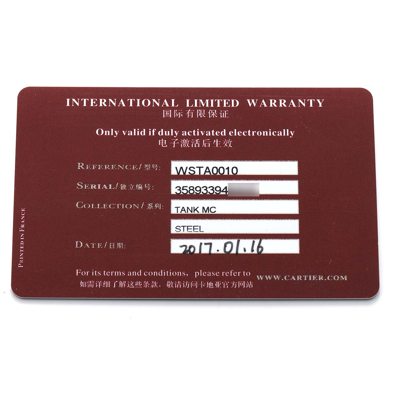 The image shows the international limited warranty card for the Cartier Tank MC WSTA0010 Men's Stainless Steel Blue Dial watch model.