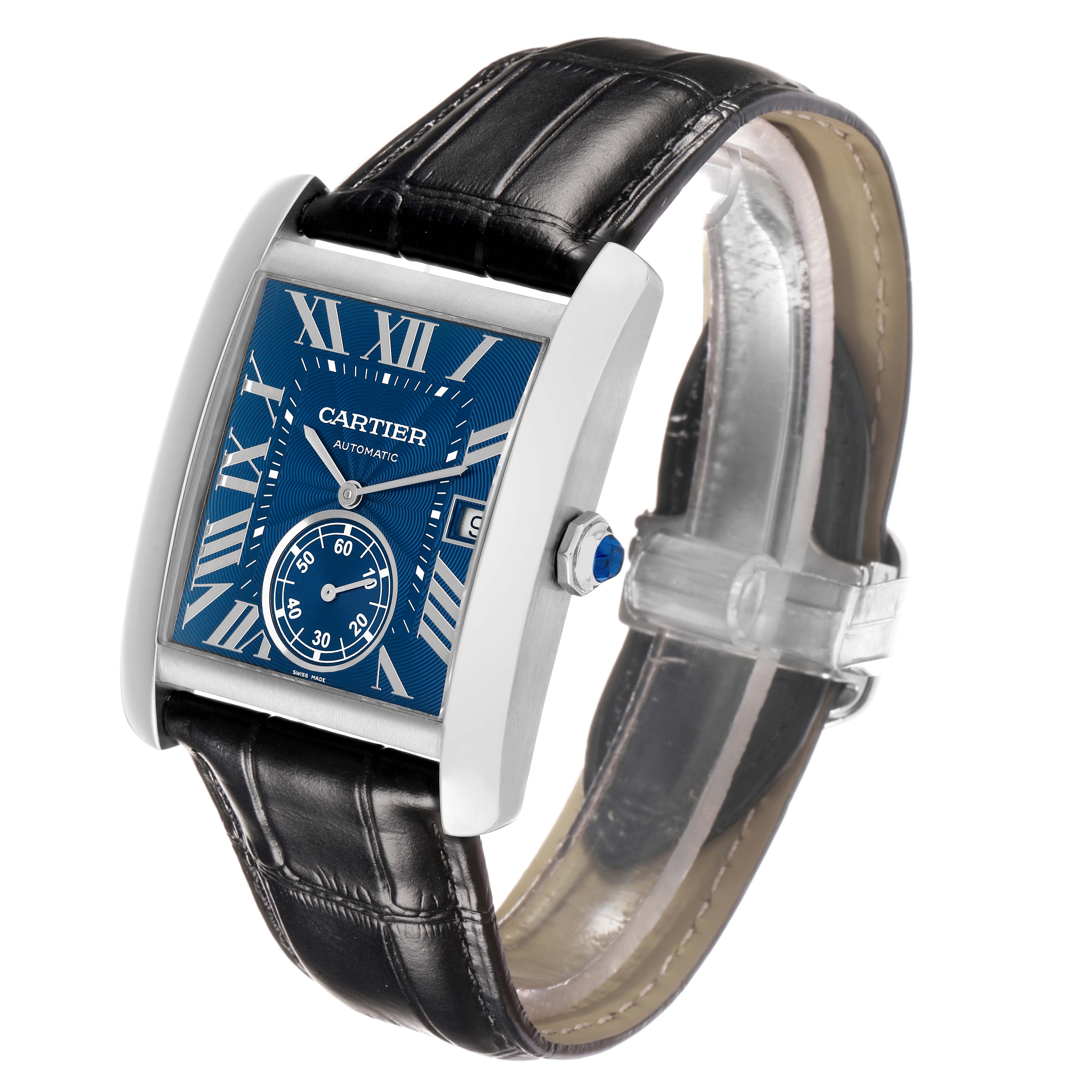 The Cartier Tank MC WSTA0010 Men's Stainless Steel Blue Dial watch is shown at an angle highlighting the blue dial, leather strap, and side profile with the crown.