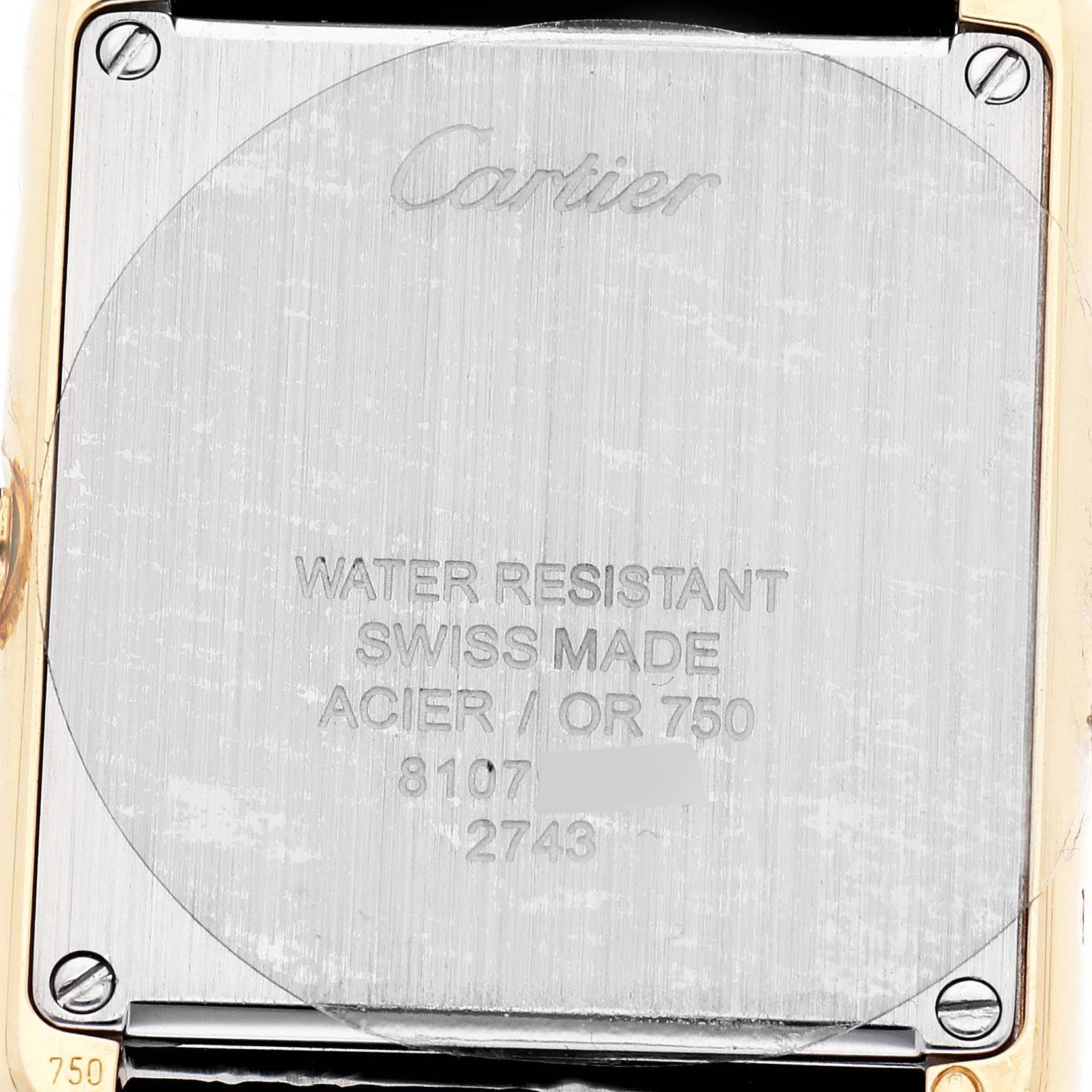 The image shows the back case of a Cartier Tank Solo W1018755 Women's Steel and Gold (two tone) Silver Dial, displaying brand engraving and specifications.
