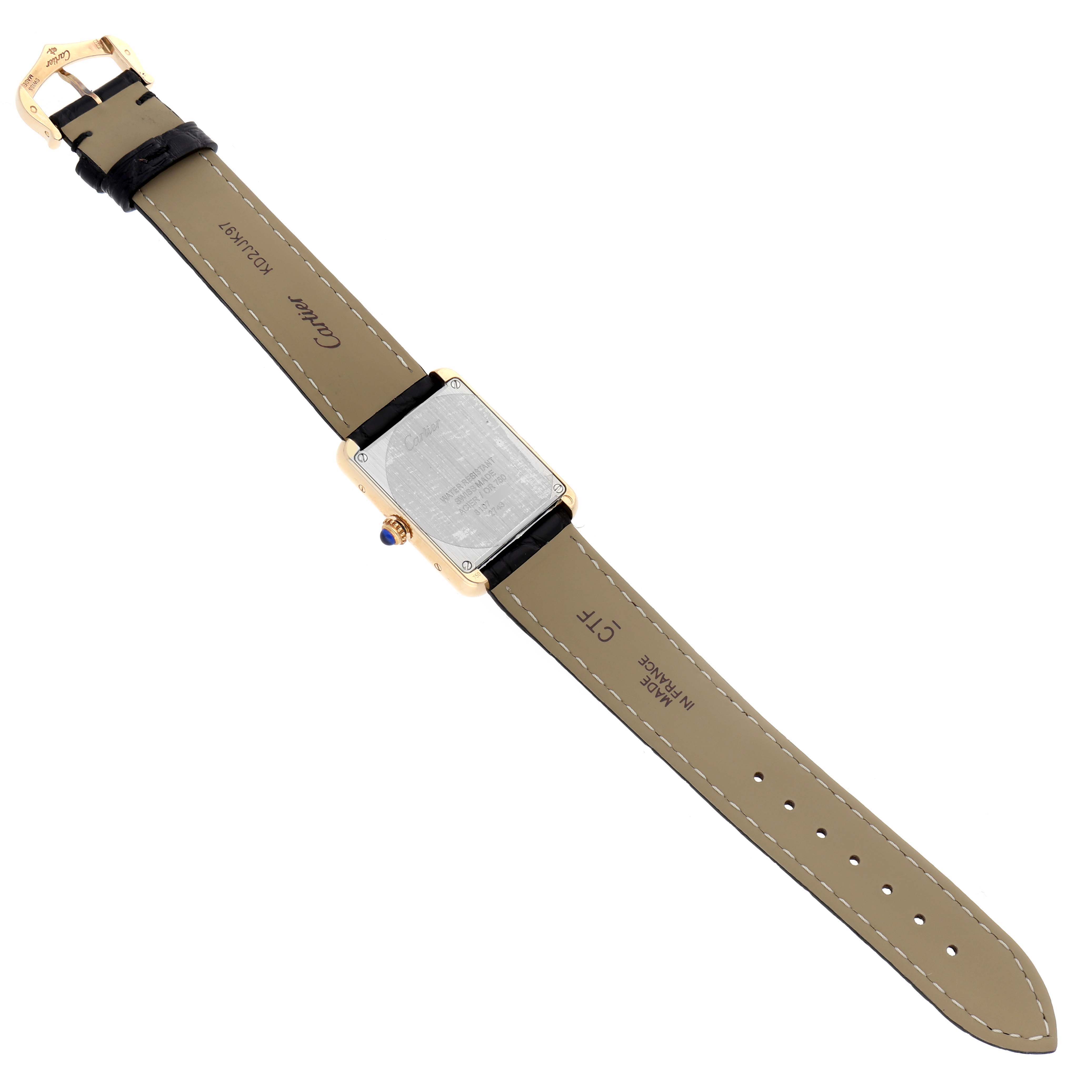 The Tank Solo by Cartier is shown from the back, highlighting the strap, buckle, and case back details.