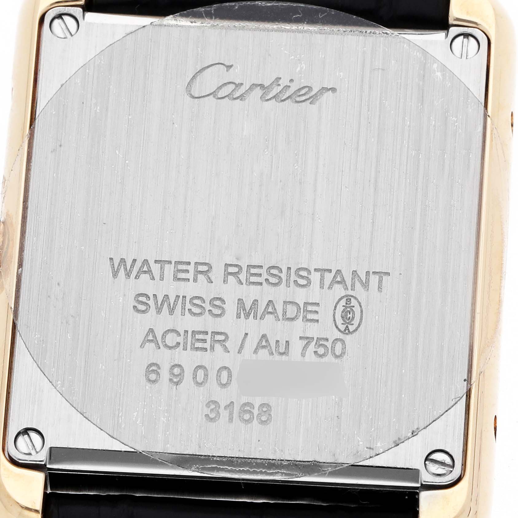 The image shows the back of the Cartier Tank Solo W5200002 Women's Steel and Gold (two tone) Silver Dial watch, displaying inscriptions and screws.