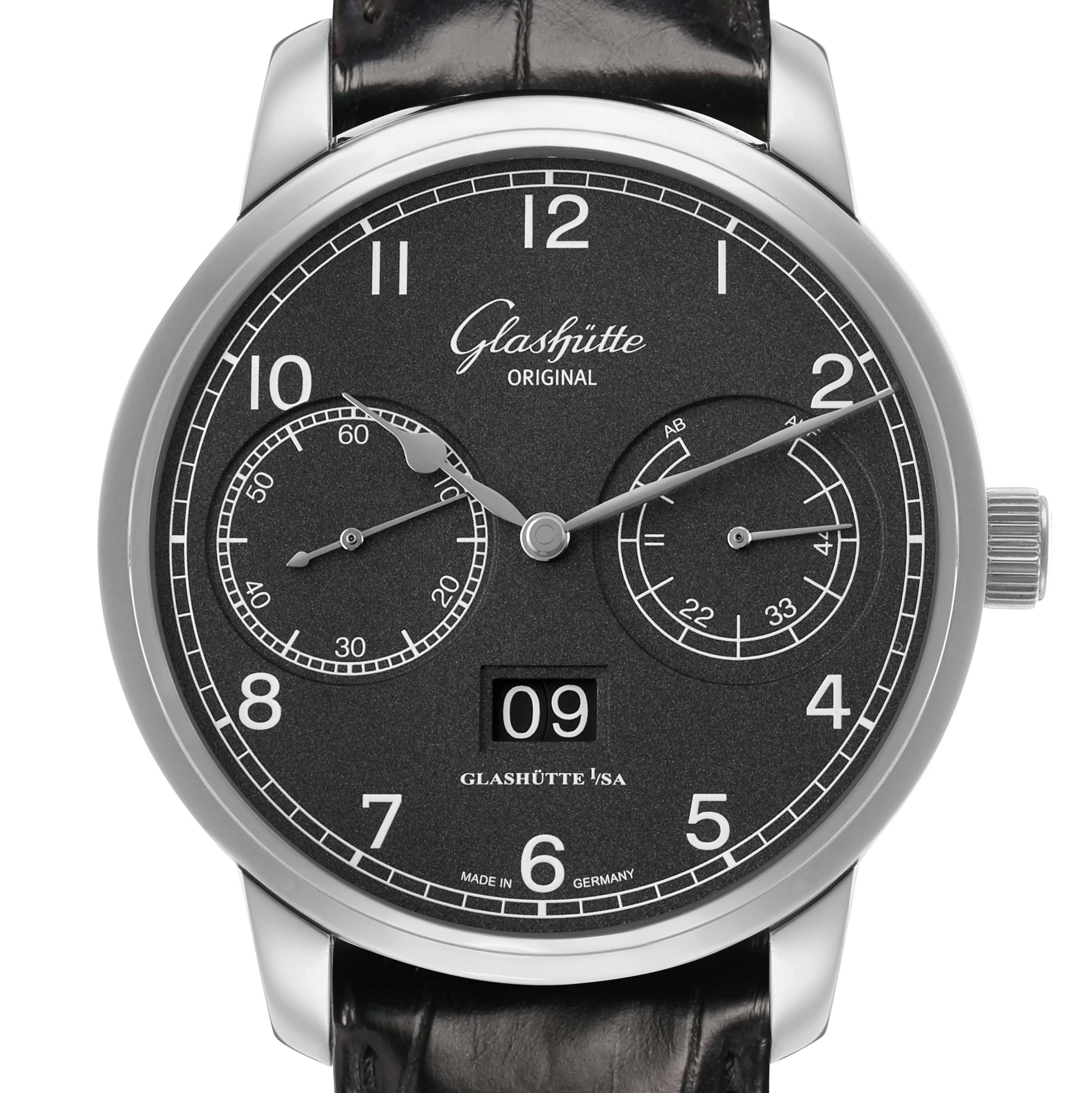 The Glashütte Senator watch is shown from a front angle, displaying its black dial, subdials, and date window.