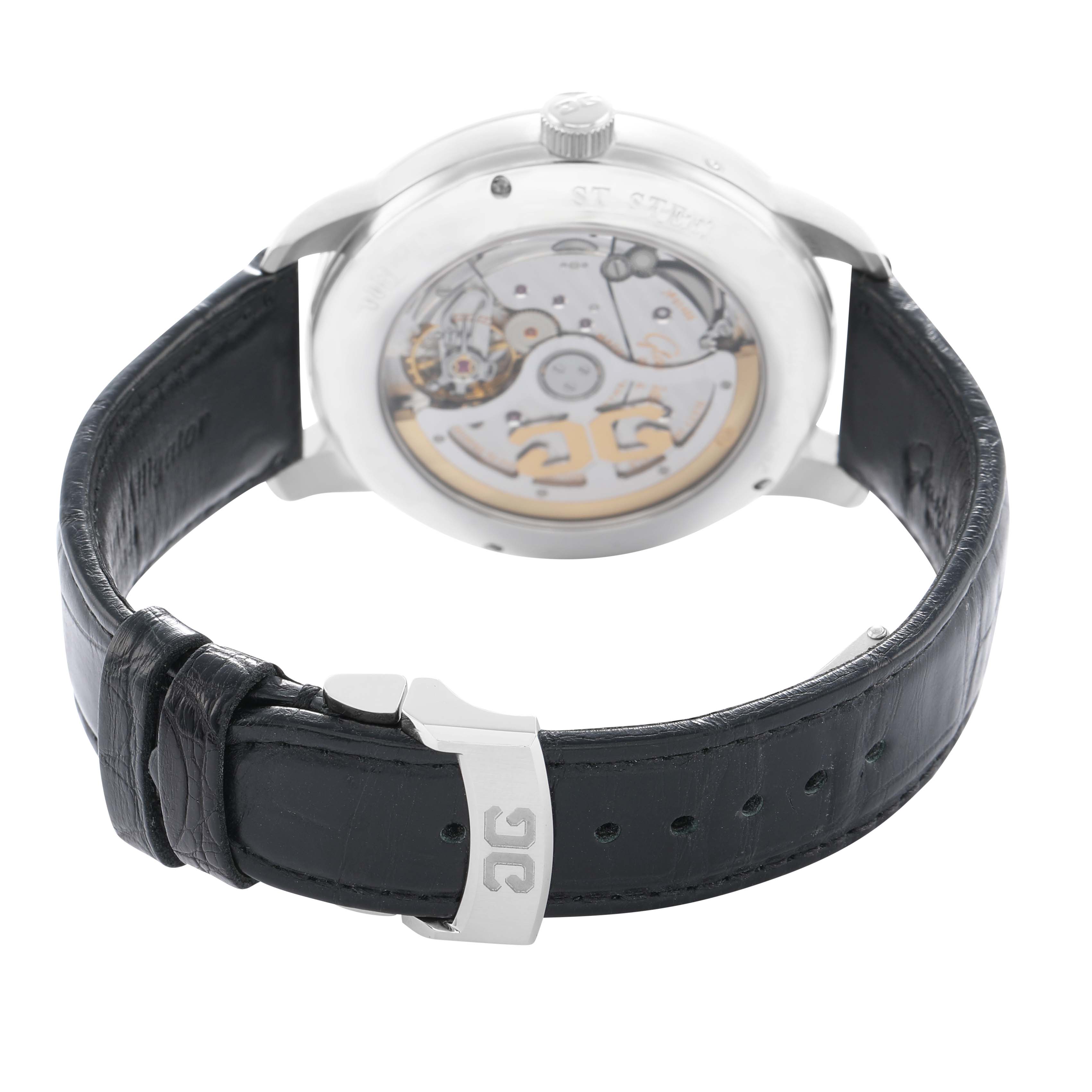 The image shows the back of the Glashütte Senator watch, highlighting the movement and leather strap with a metal clasp.