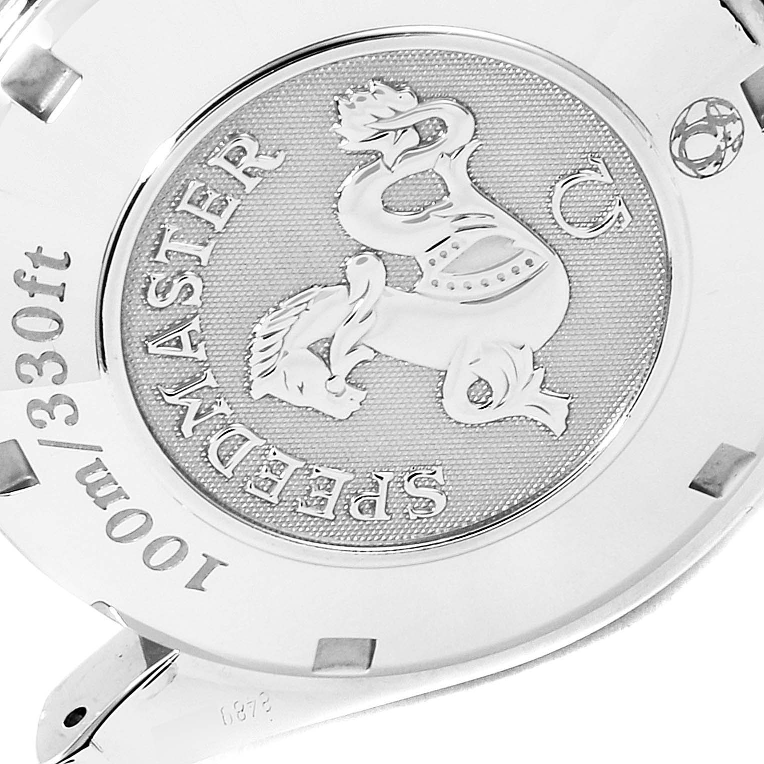 The image shows the back of an Omega Speedmaster 323.10.40.40.02.001 Men
s Stainless Steel Silver Dial 323.10.40.40.02.001 Men
s Stainless Steel Silver Dial watch, highlighting its engraved emblem and water resistance details (100m/330ft).