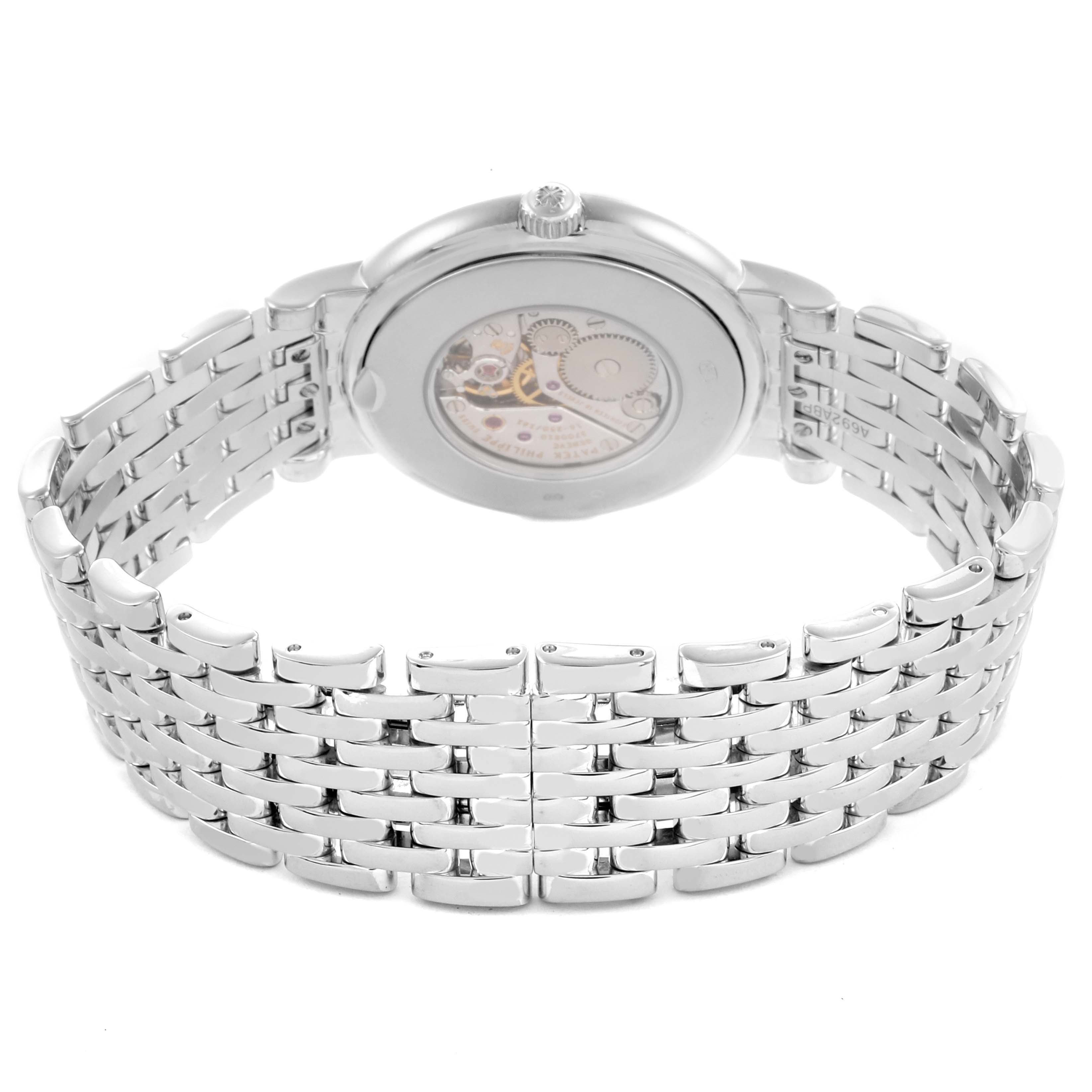 The image shows a rear view of the Patek Philippe Calatrava 4958/1G-001 Women's White Gold Silver Dial 4958/1G-001 Women's White Gold Silver Dial, highlighting its metal bracelet and transparent case back.