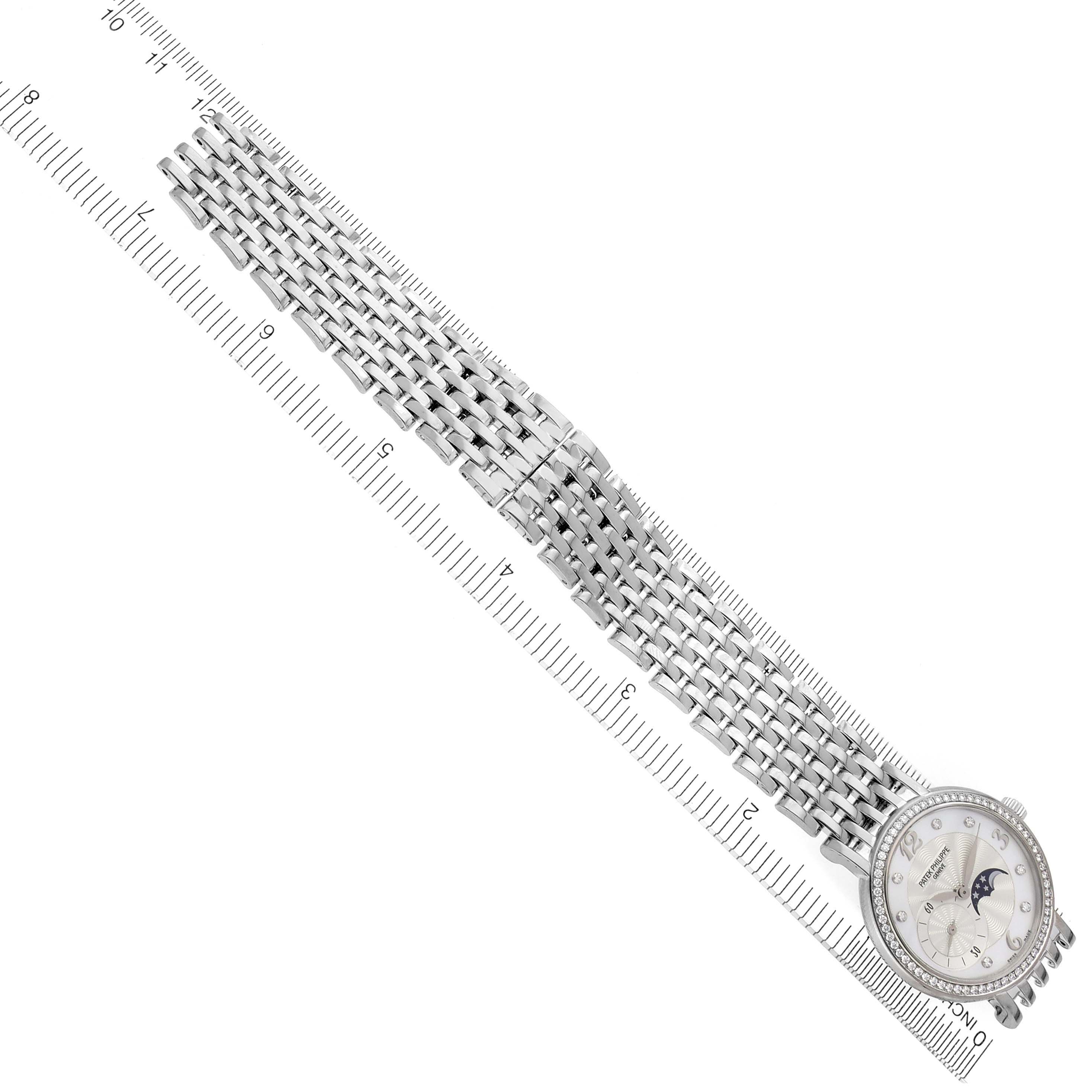 The image shows a Patek Philippe Calatrava 4958/1G-001 Women's White Gold Silver Dial 4958/1G-001 Women's White Gold Silver Dial watch at an angled top view, highlighting the face, bezel, and metal bracelet.