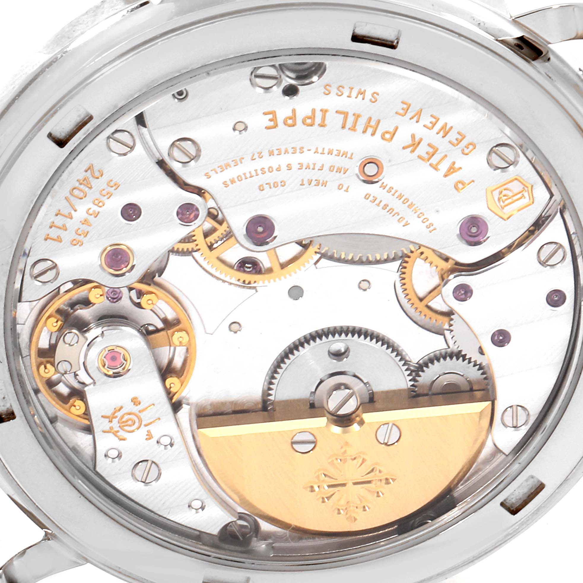 The image shows the back view of a Patek Philippe Calatrava 5120G Men's White Gold White Dial 5120G Men's White Gold White Dial, highlighting its intricate movement and gears.