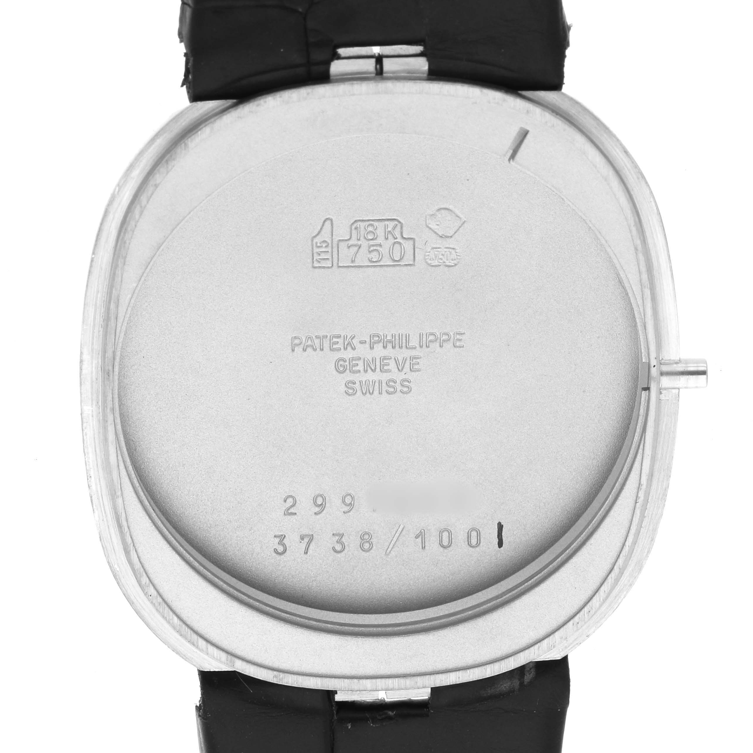 The image shows the back case of the Patek Philippe Golden Ellipse 3738 Men's White Gold Blue Dial, highlighting engravings and hallmarks.