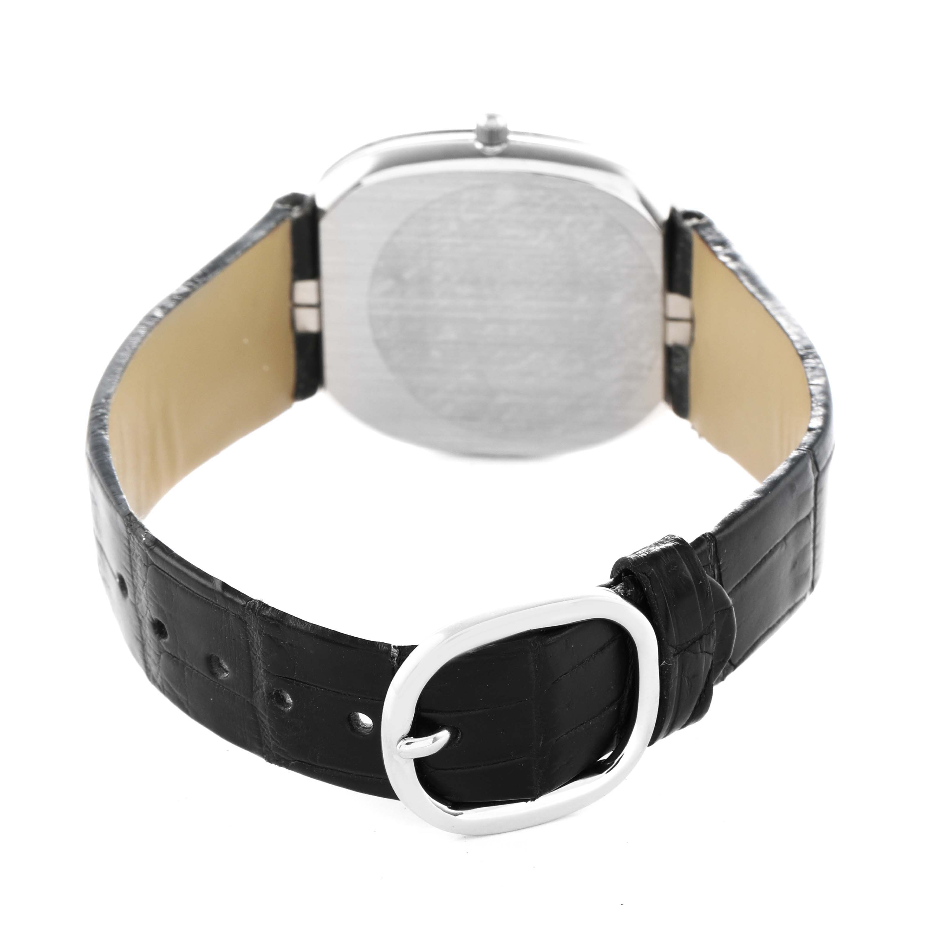 The image shows the back of the Patek Philippe Golden Ellipse 3738 Men's White Gold Blue Dial, focusing on the case back and leather strap with a buckle.