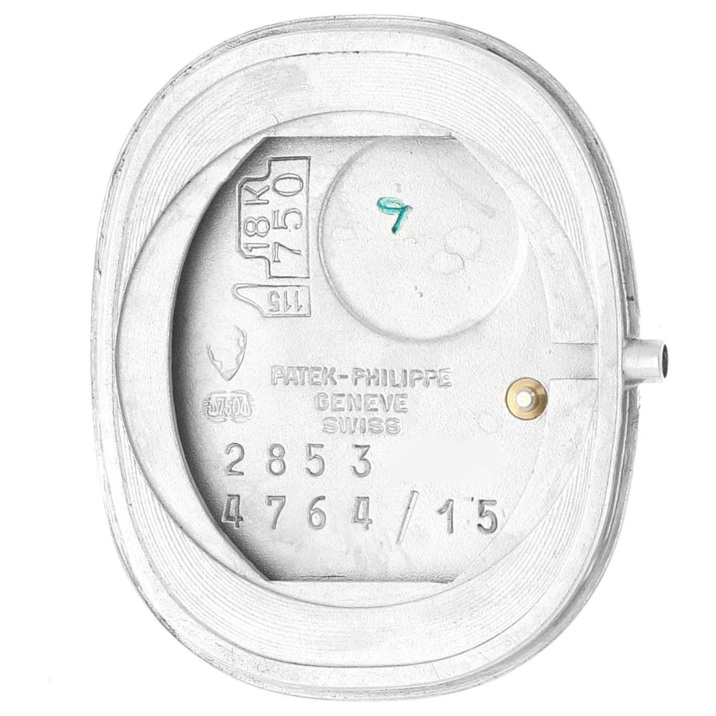 The image shows the inside back case of a Patek Philippe Golden Ellipse 4764/15 Women's White Gold Silver Dial 4764/15 Women's White Gold Silver Dial watch, displaying engravings and hallmarks.