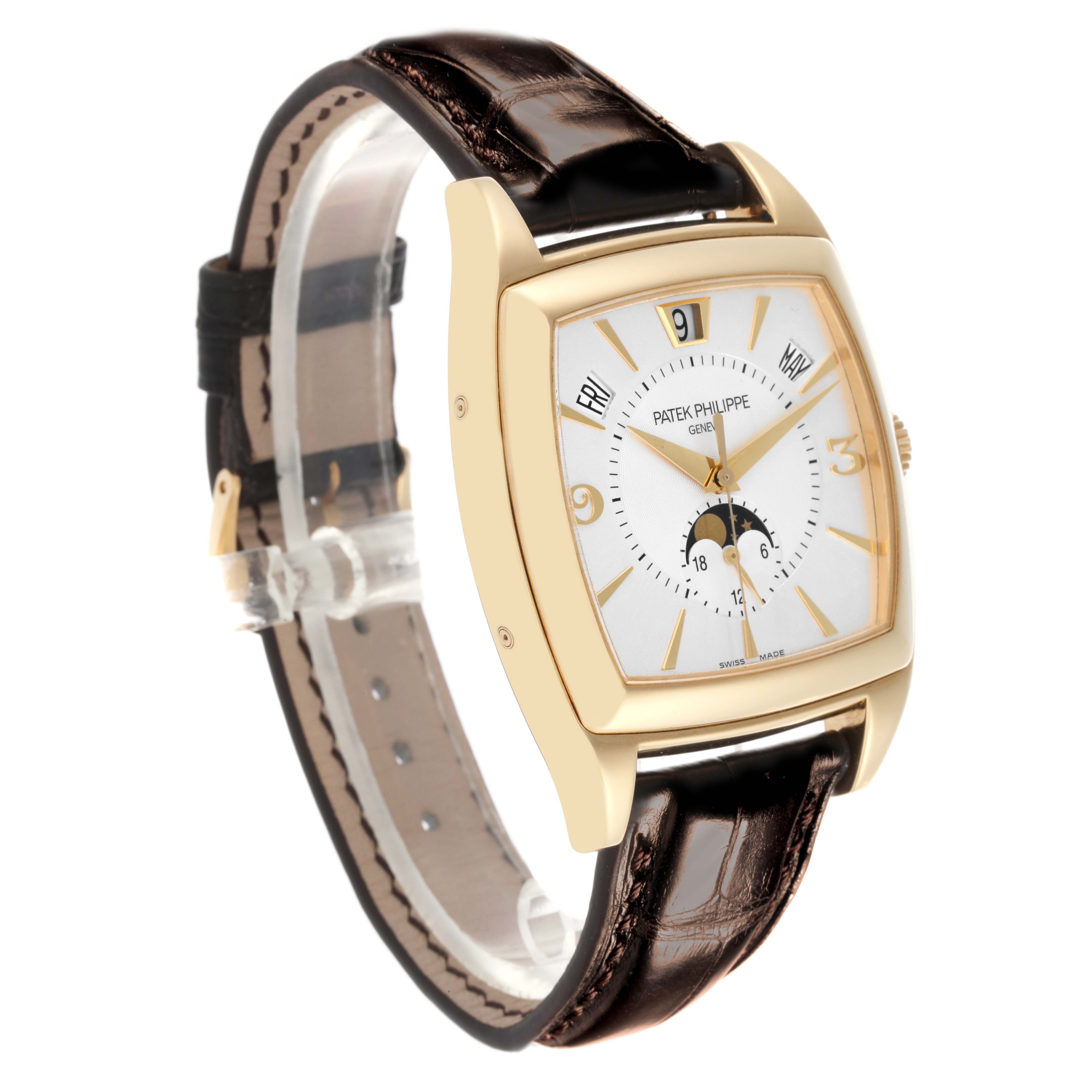 The Patek Philippe Gondolo 5135J-001 Men's Yellow Gold Silver Dial 5135J-001 Men's Yellow Gold Silver Dial watch is shown at a three-quarter angle, highlighting its face, strap, and side profile.