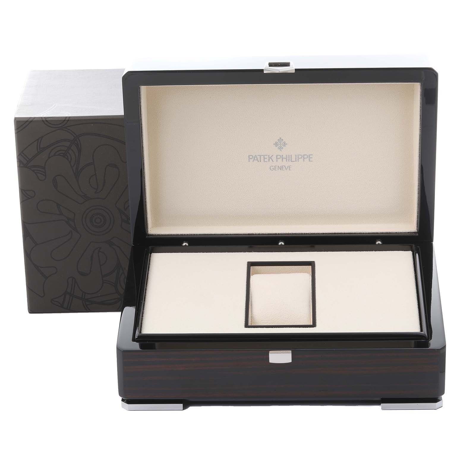 The image shows an open Patek Philippe Gondolo 5135J-001 Men's Yellow Gold Silver Dial 5135J-001 Men's Yellow Gold Silver Dial watch box from the front angle, displaying its interior and design.