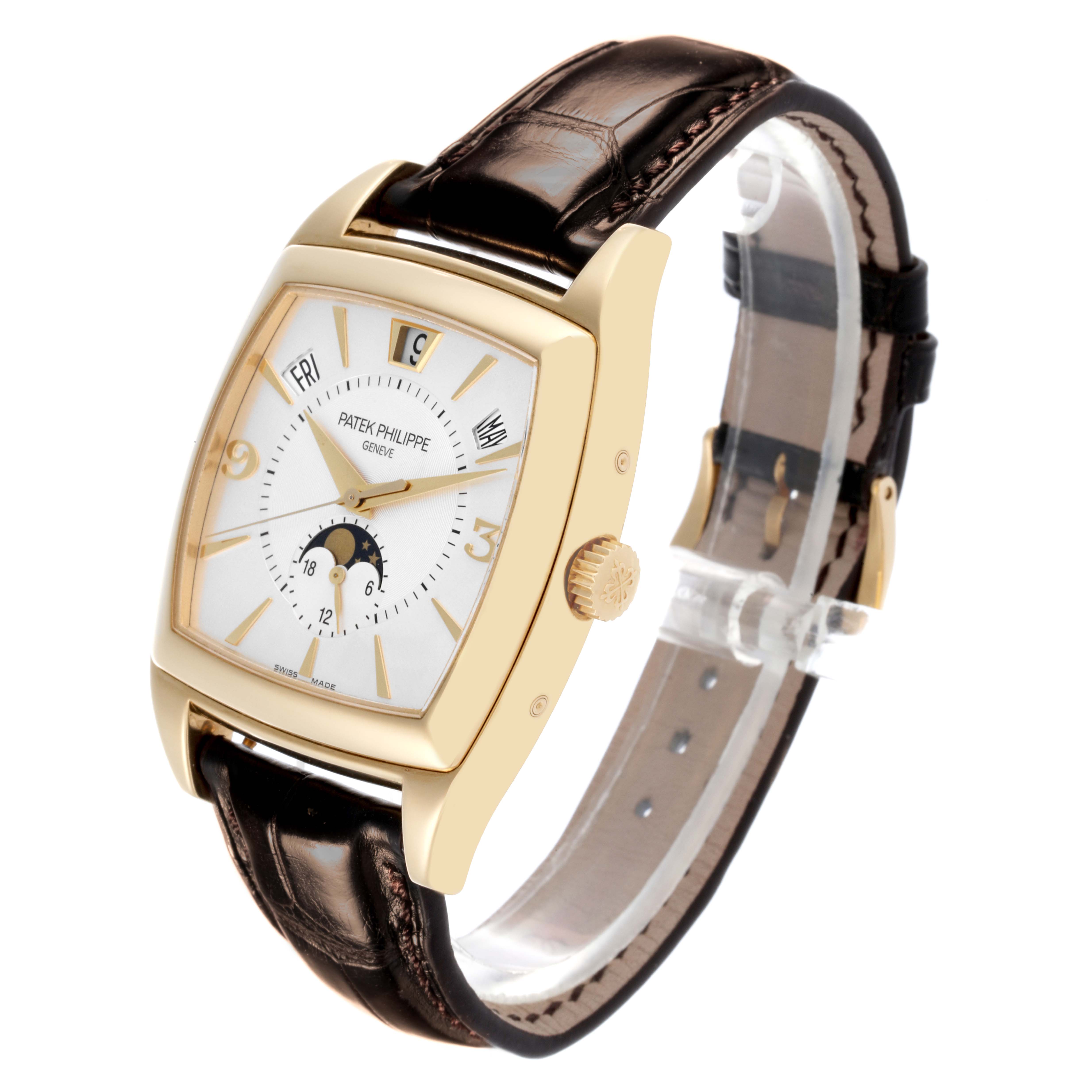 The Patek Philippe Gondolo 5135J-001 Men's Yellow Gold Silver Dial 5135J-001 Men's Yellow Gold Silver Dial watch is shown from a three-quarter angle, highlighting the face, dial, case, and leather strap.