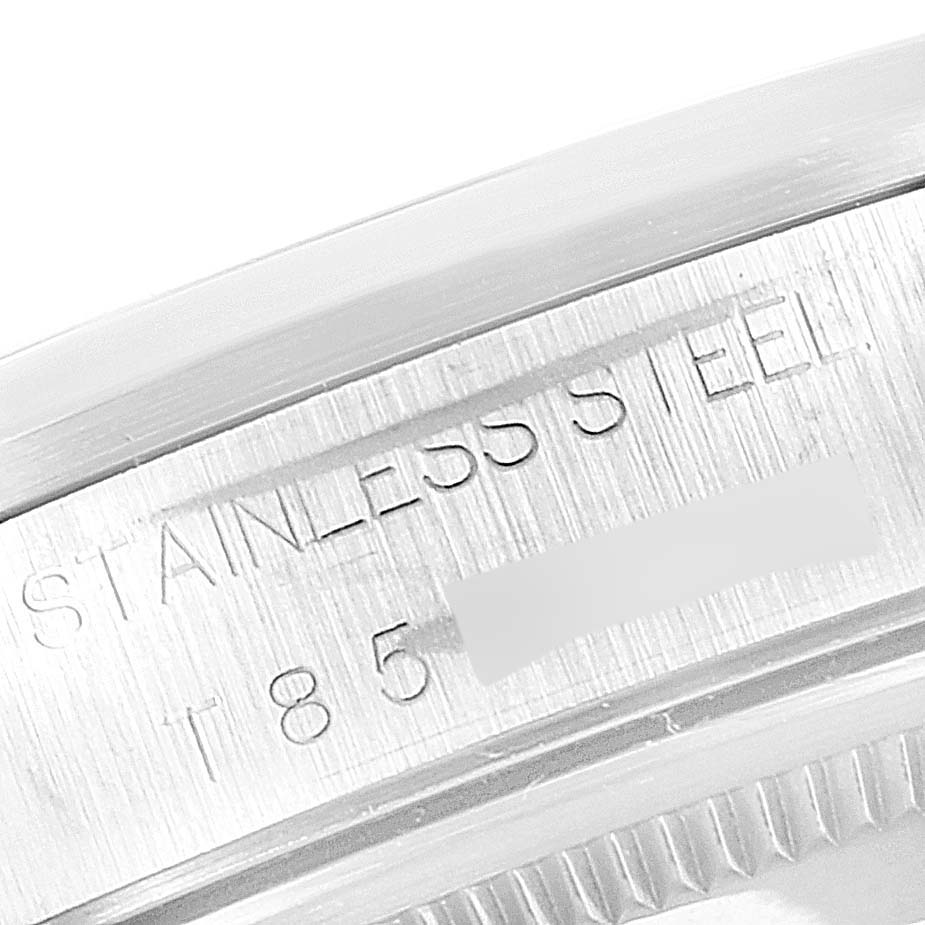 This image shows a close-up view of the edge of a Rolex Air-King 14000 Men's Stainless Steel Blue Dial 14000 Men's Stainless Steel Blue Dial watch case with "STAINLESS STEEL" engraving.