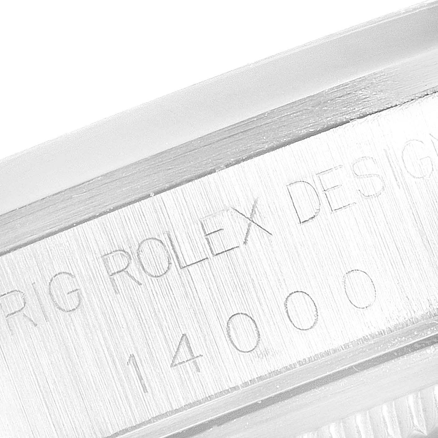 This close-up image showcases the engraved side of the casing of a Rolex Air-King 14000 Men's Stainless Steel Pink Dial 14000 Men's Stainless Steel Pink Dial watch.