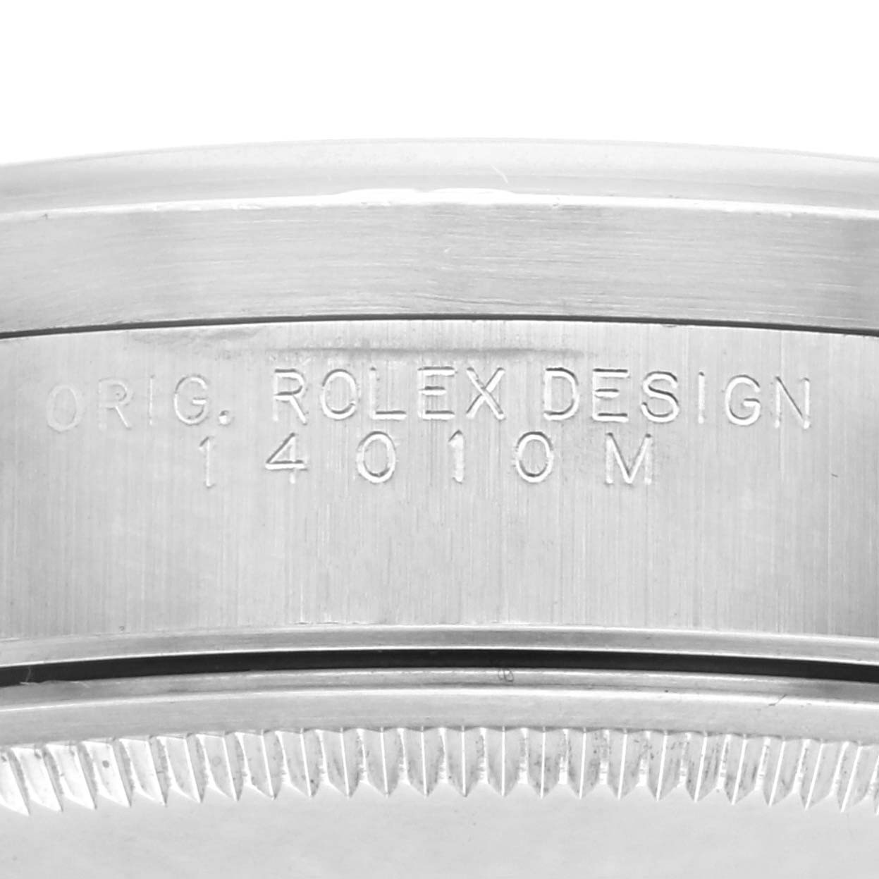 The image shows the side of a Rolex Air-King 14010M Men's Stainless Steel Blue Dial 14010M Men's Stainless Steel Blue Dial model with "ORIG. ROLEX DESIGN 14010M" etched on the case.