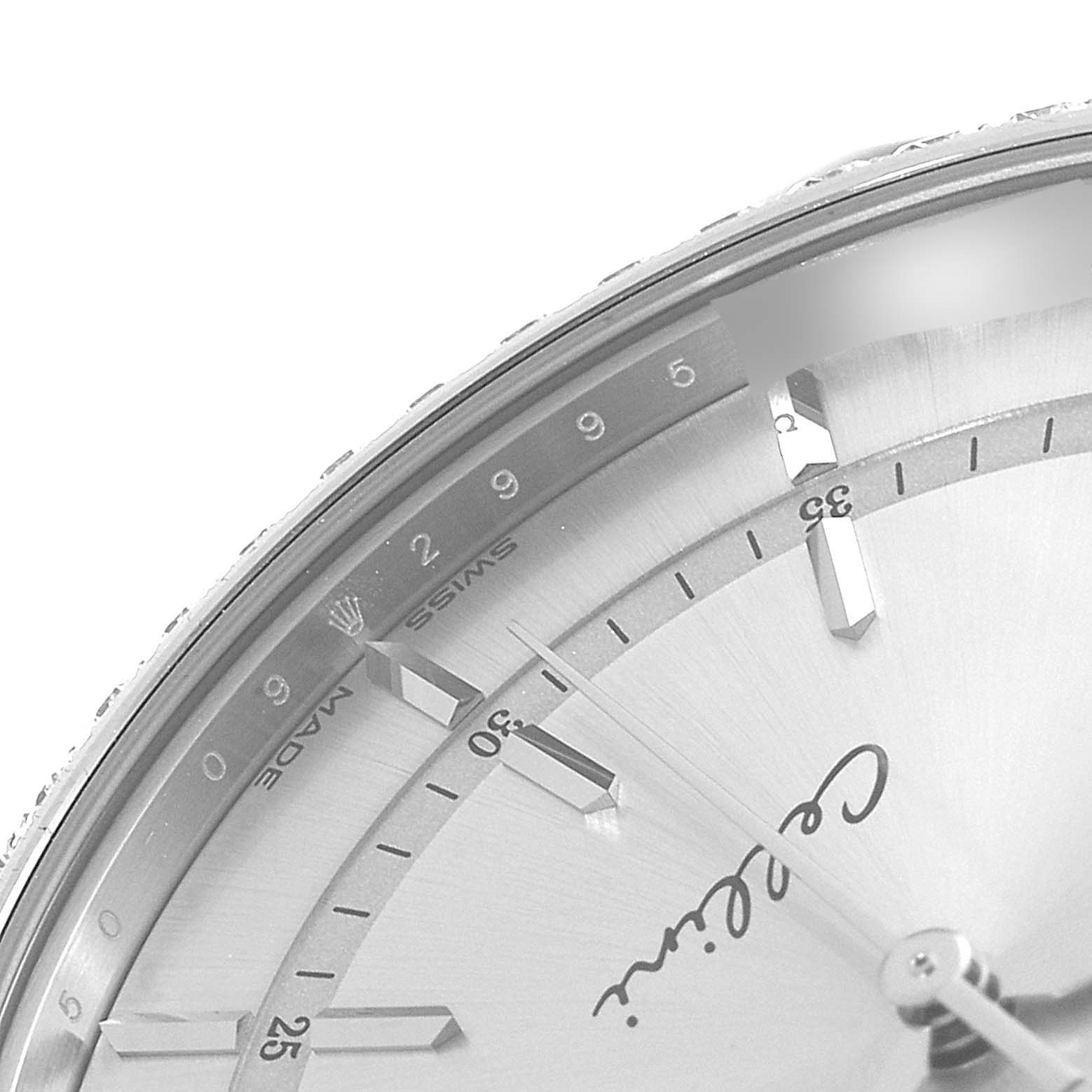 The image shows a close-up of the dial and part of the bezel of a Rolex Cellini 50709 Men's White Gold Silver Dial 50709 Men's White Gold Silver Dial watch, highlighting the brand name and hour markers.