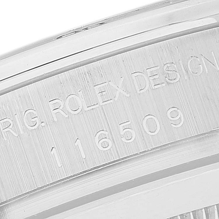 The image shows a close-up angle of the serial number engraving on the side of a Rolex Daytona 116509 Men's White Gold Black Dial 116509 Men's White Gold Black Dial watch case.