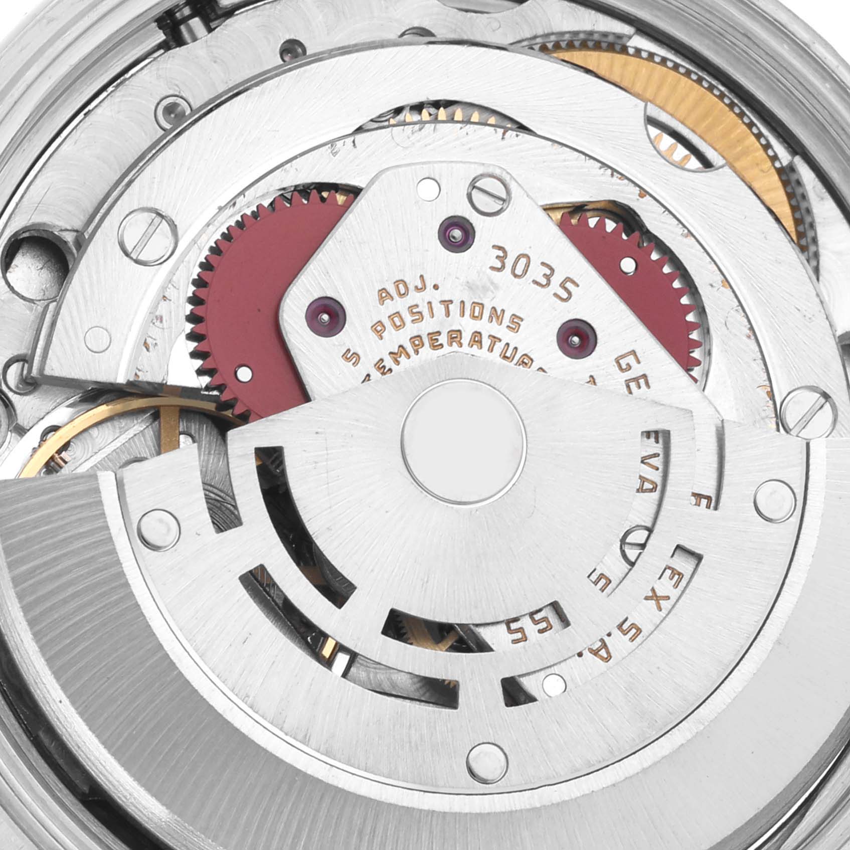 The image shows a close-up of the movement mechanism of a Rolex Vintage Collection 15010 Men's Stainless Steel Silver Dial 15010 Men's Stainless Steel Silver Dial watch, highlighting gears and inscriptions.