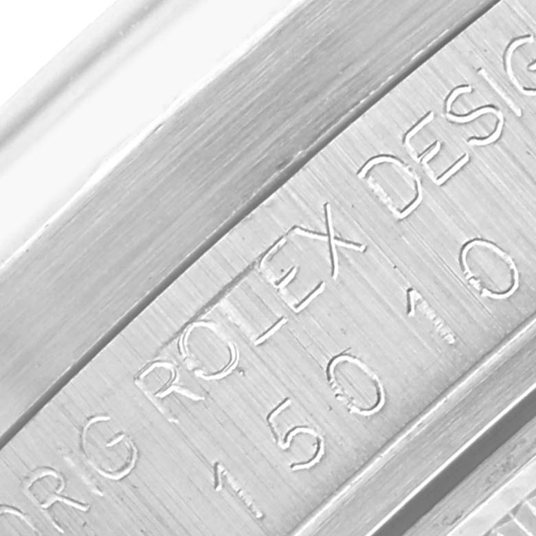 The image shows a close-up of the engraved inner bezel of a Rolex Vintage Collection 15010 Men's Stainless Steel Silver Dial 15010 Men's Stainless Steel Silver Dial watch.