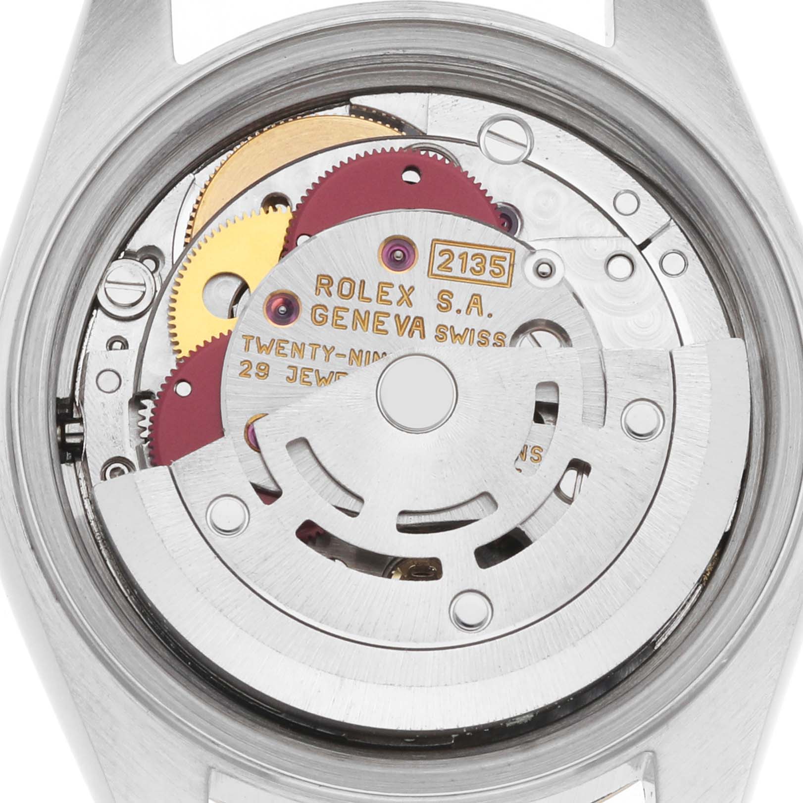 The image shows the movement mechanism of a Rolex Datejust 69173 Women's Stainless Steel Red Dial, viewed from the back, highlighting gears and the rotor.