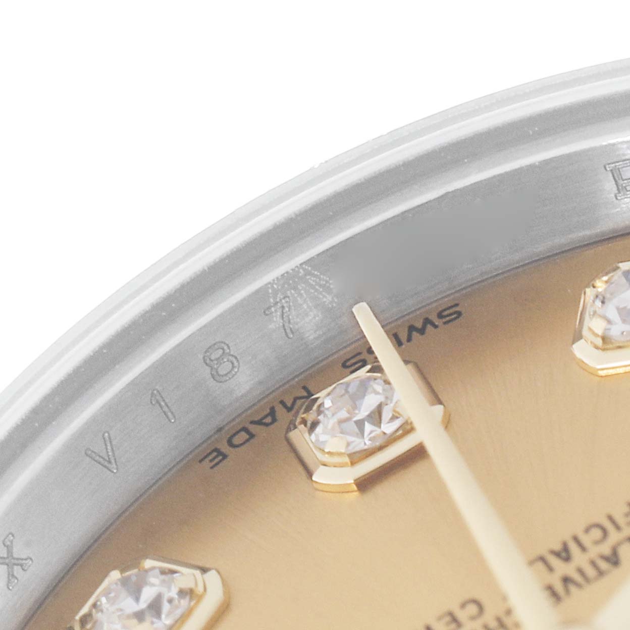 This image shows a close-up of the dial and the partially visible rehaut of a Rolex Datejust 179173 Women's Steel and Gold (two tone) Champagne Dial 179173 Women's Steel and Gold (two tone) Champagne Dial watch.