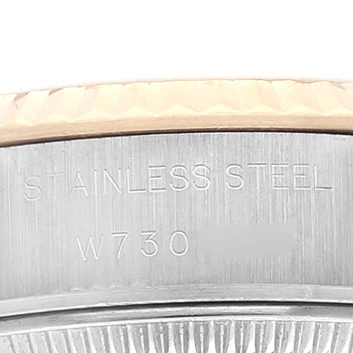 This close-up image shows the side engraving on a stainless steel Rolex Datejust 69173 Women's Steel and Gold (two tone) Champagne Dial 69173 Women's Steel and Gold (two tone) Champagne Dial watch.