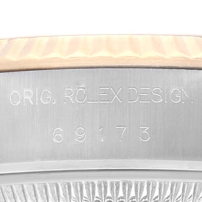 The image shows a close-up of the engraved case side of a Rolex Datejust 69173 Women's Steel and Gold (two tone) Champagne Dial 69173 Women's Steel and Gold (two tone) Champagne Dial watch, specifically highlighting the "Orig. Rolex Design" and model number 69173.
