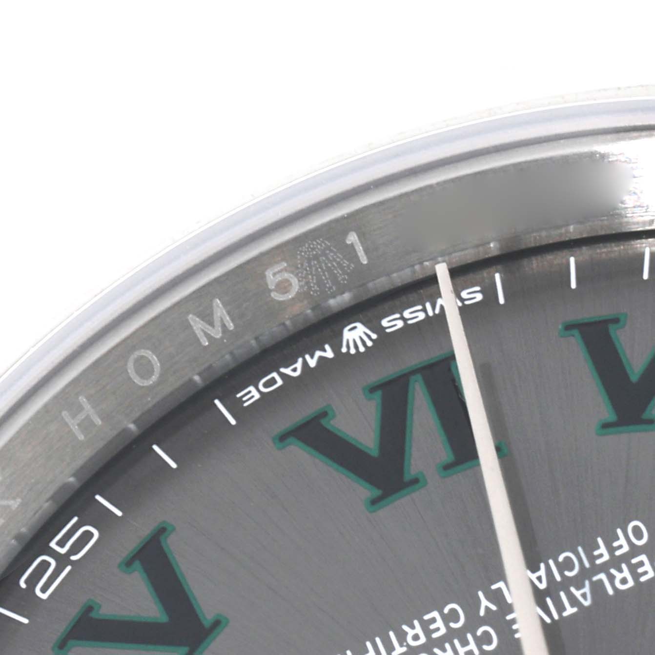 This image shows a close-up of the dial and inner bezel of a Rolex Datejust 126200 Men's Stainless Steel Grey Dial 126200 Men's Stainless Steel Grey Dial watch, highlighting the "Swiss Made" text and Roman numeral markers.