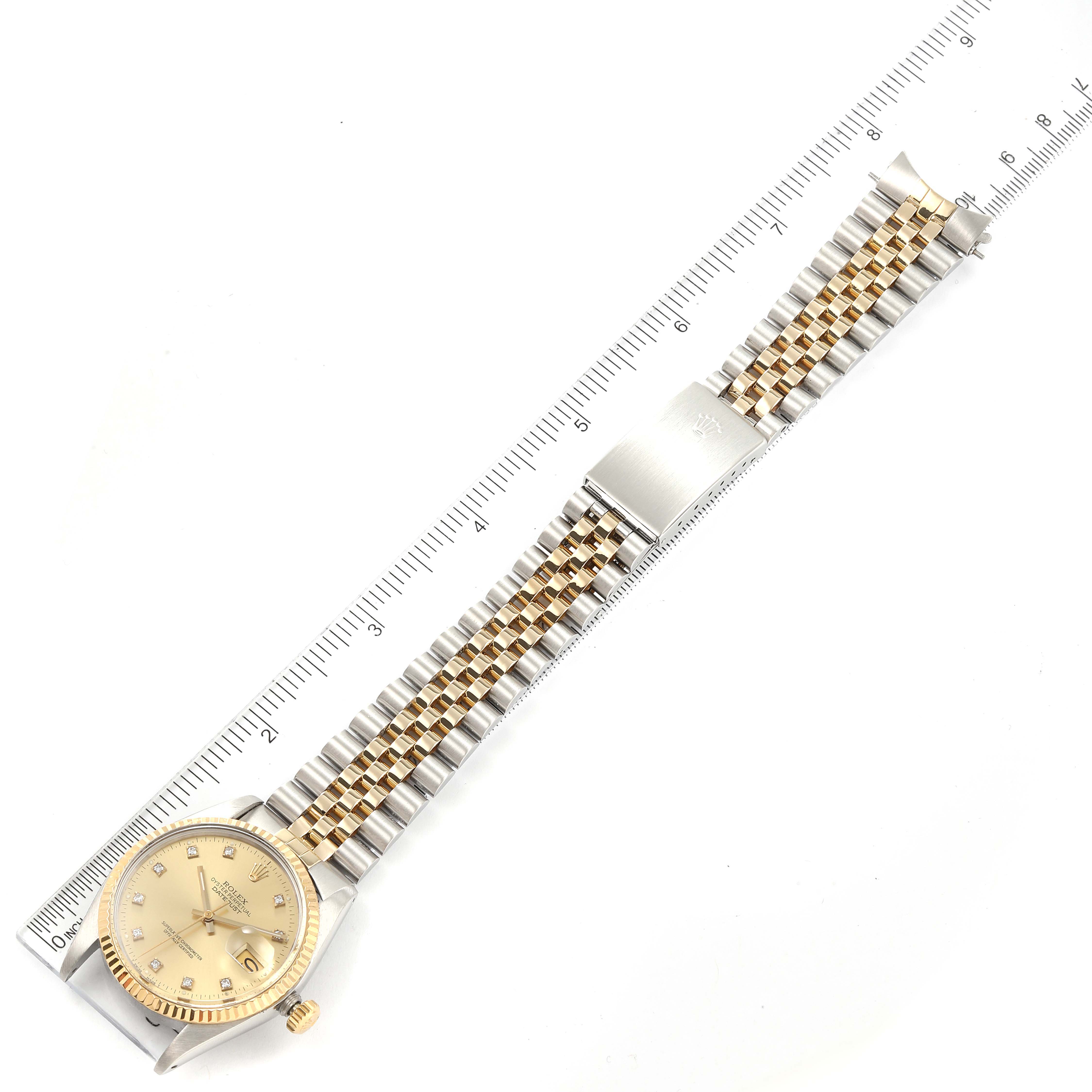 The image shows the Rolex Vintage Collection 16013 Men's Steel and Gold (two tone) Champagne Dial 16013 Men's Steel and Gold (two tone) Champagne Dial watch laid flat from a top-down angle, displaying its face, bracelet, clasp, and ruler for scale.