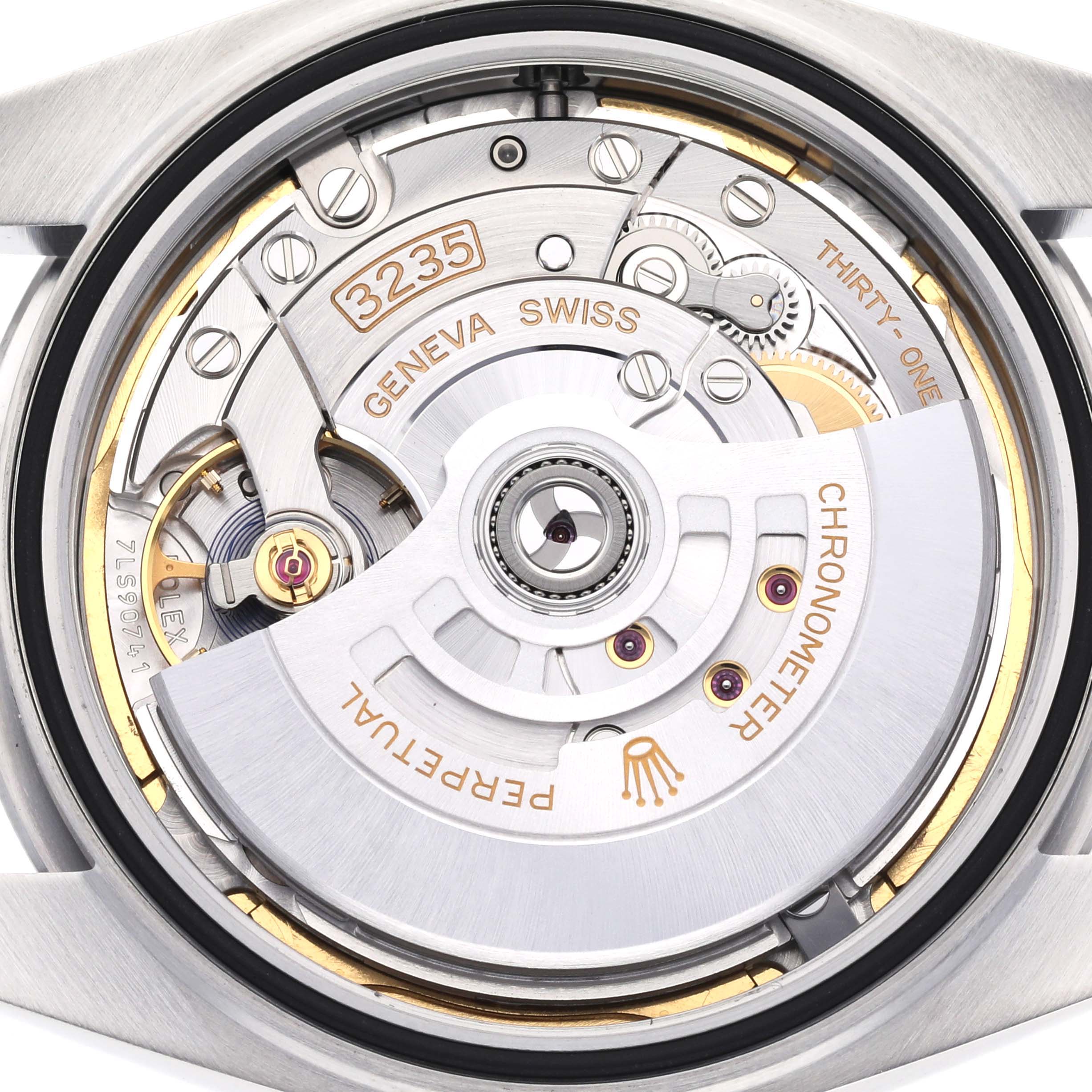 The image shows a close-up angle of the Rolex Datejust 41 126300 Men
s Stainless Steel Blue Dial 126300 Men
s Stainless Steel Blue Dial movement, highlighting the rotor and mechanical components.