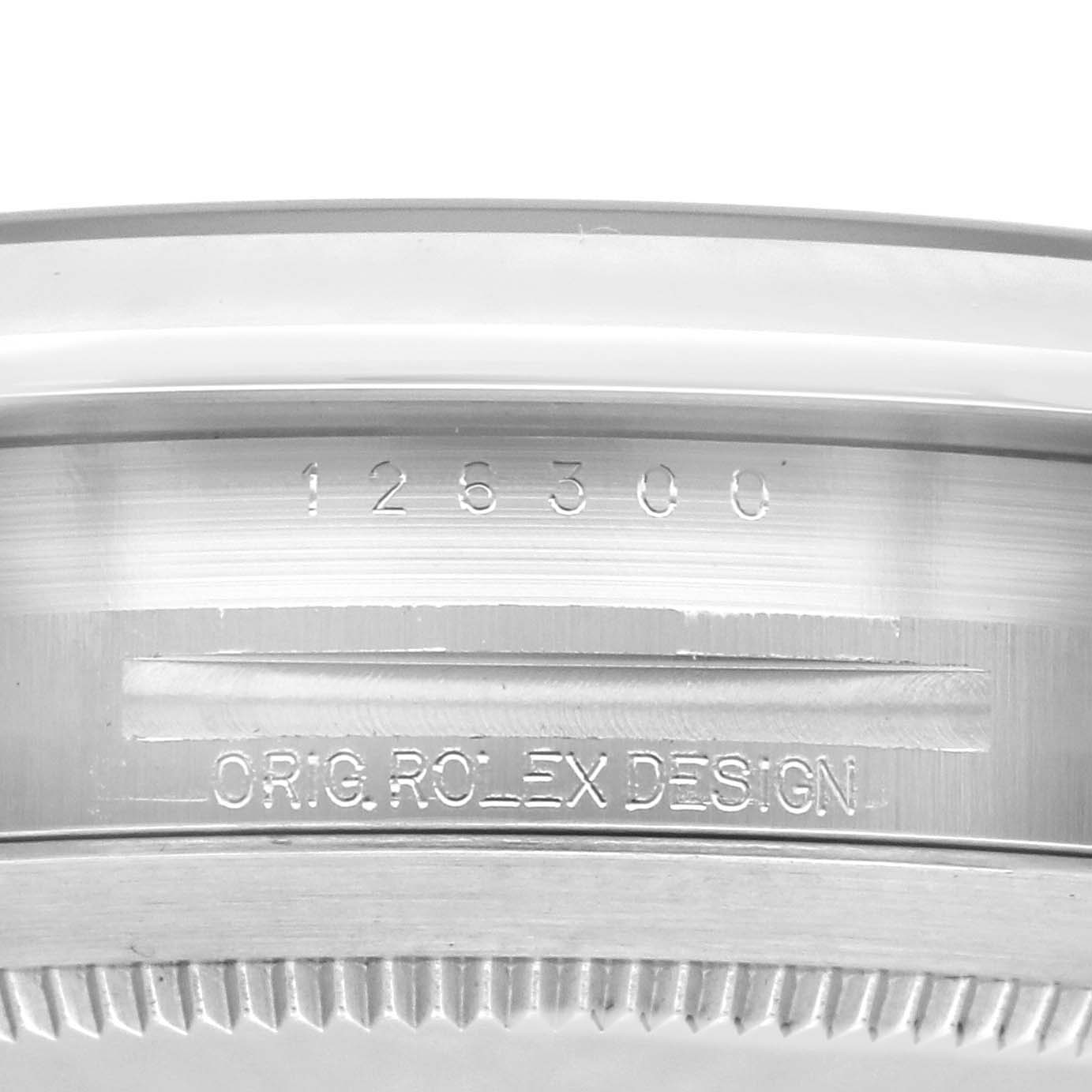 The image shows a close-up view of the side of a Rolex Datejust 41 126300 Men
s Stainless Steel Blue Dial 126300 Men
s Stainless Steel Blue Dial, highlighting its model number and engraving.