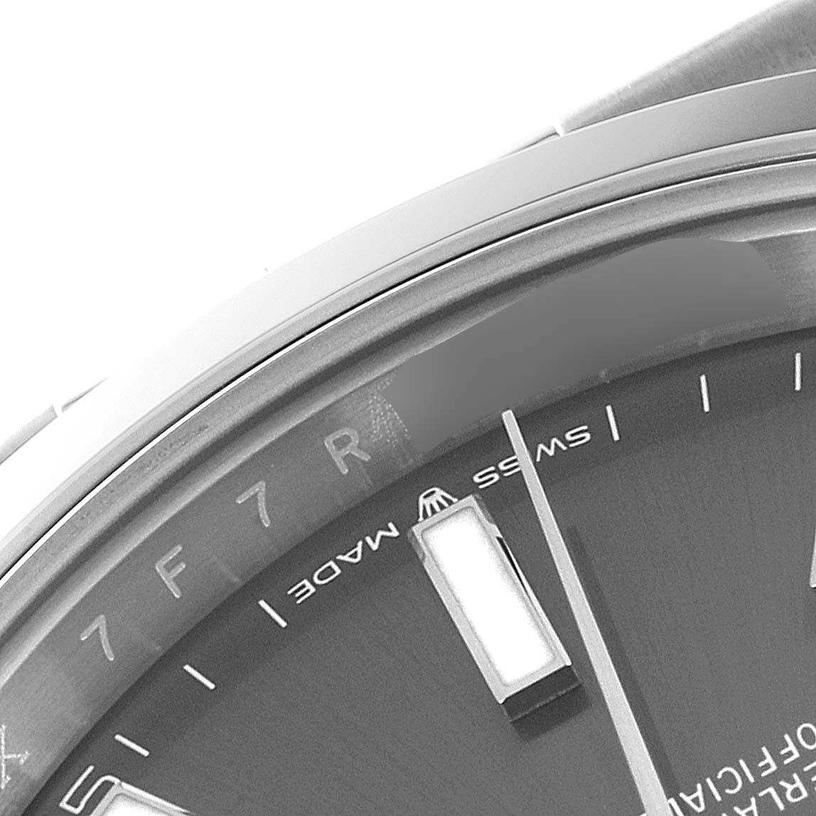 The image shows a close-up of the dial and bezel, highlighting the hour markers and part of the text on the Rolex Datejust 41 126300 Men
s Stainless Steel Grey Dial 126300 Men
s Stainless Steel Grey Dial model.