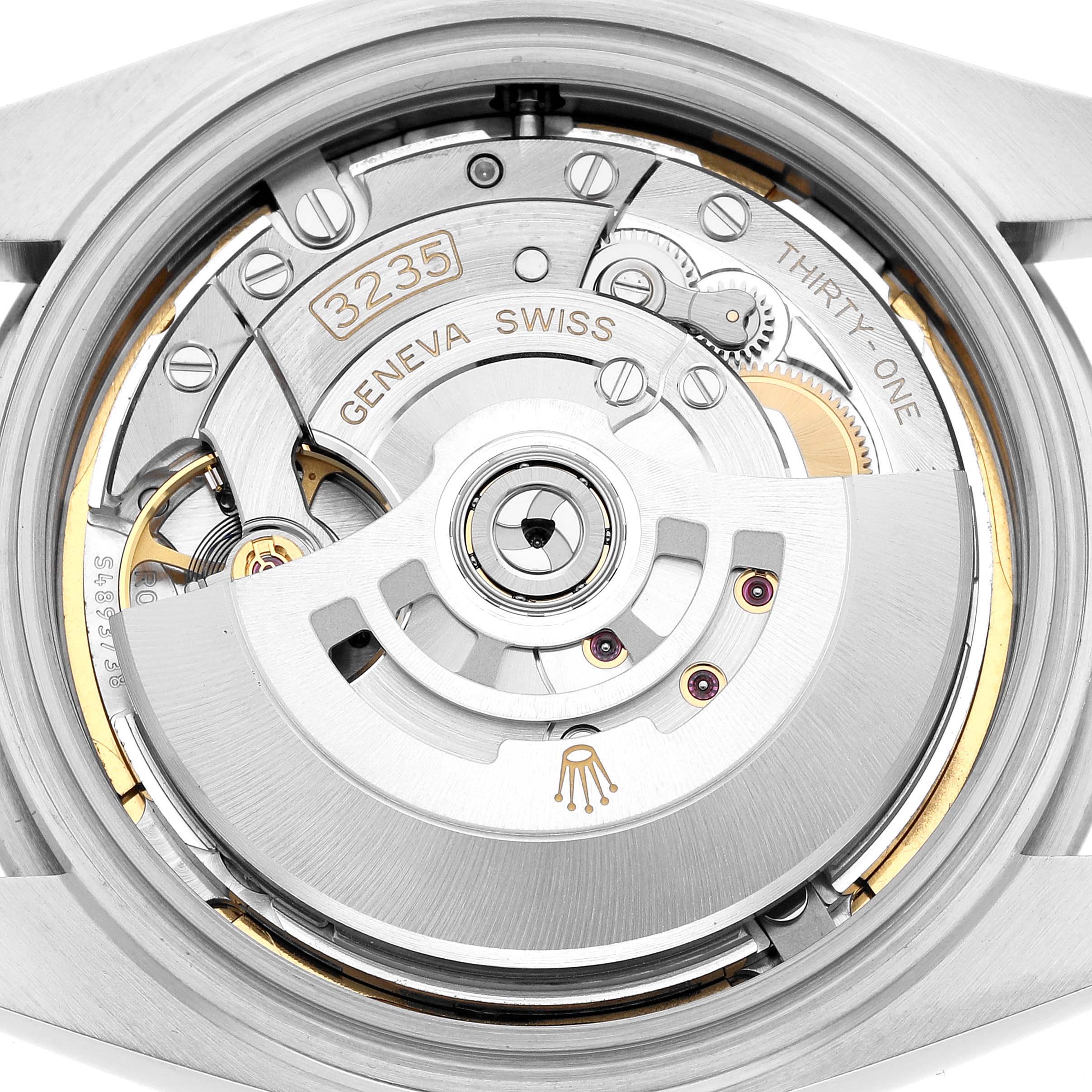 The image shows the movement of a Rolex Datejust 41 126334 Men's Stainless Steel Blue Dial watch, featuring the rotor and inner mechanics from a back angle.