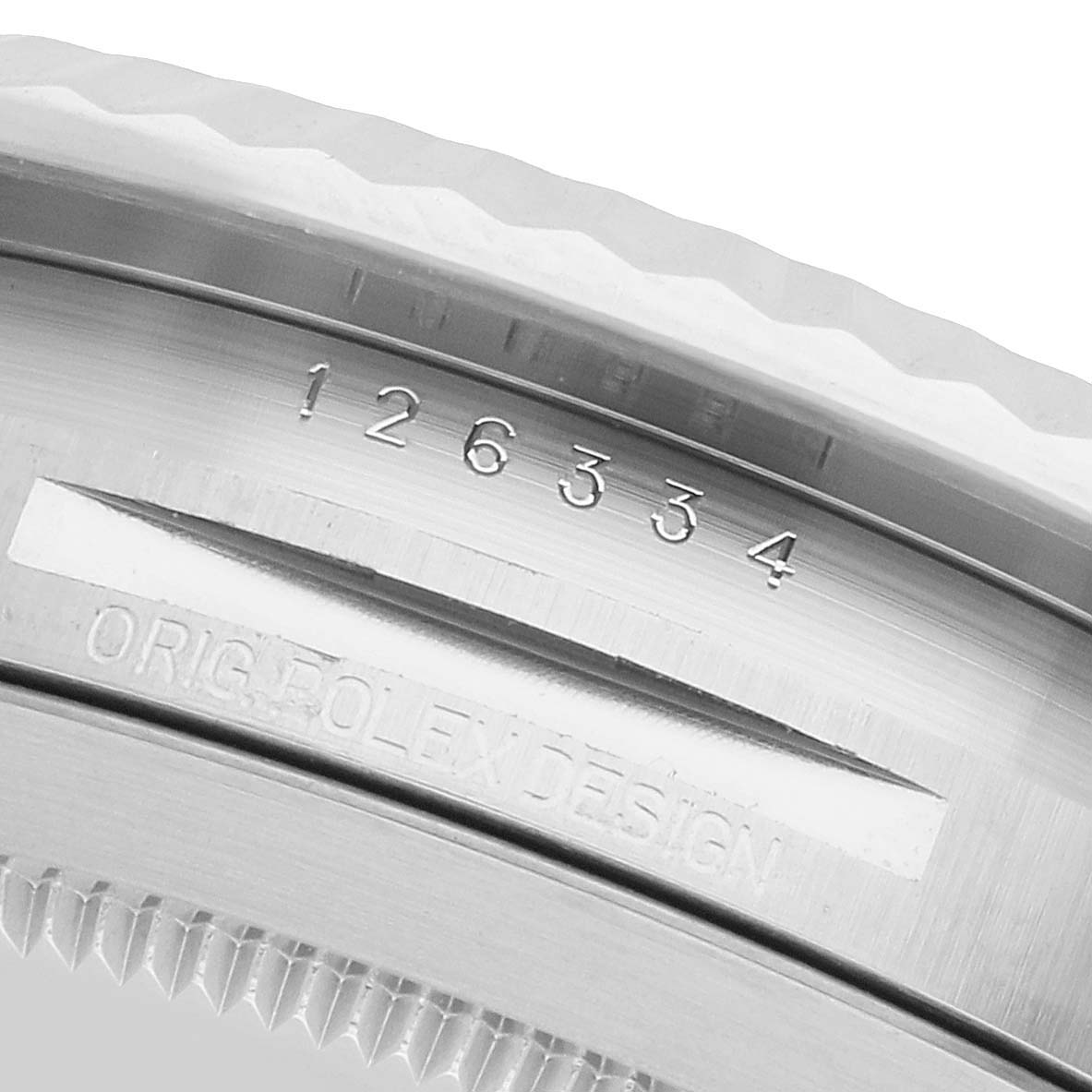 The image shows the side view of the Rolex Datejust 41 126334 Men's Stainless Steel Blue Dial bezel with engravings and reference numbers.