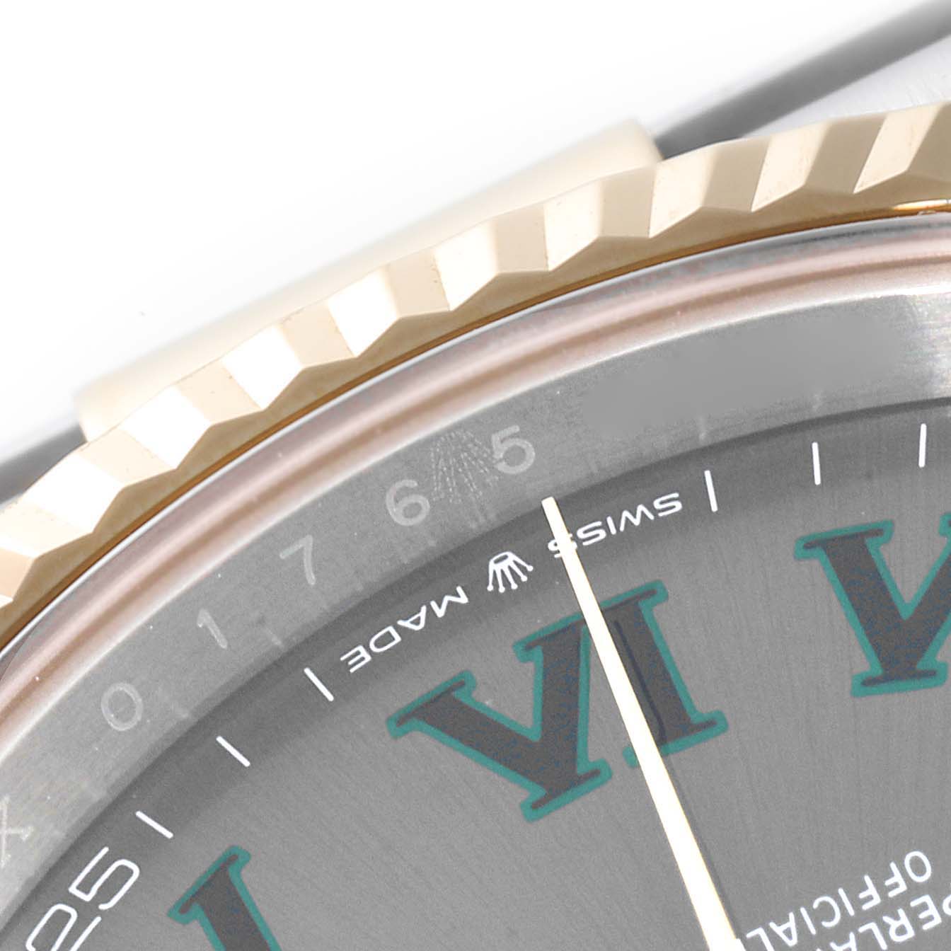 The image shows a close-up of the bezel and part of the dial of the Rolex Datejust 41 126333 Men's Steel and Gold (two tone) Grey Dial 126333 Men's Steel and Gold (two tone) Grey Dial.