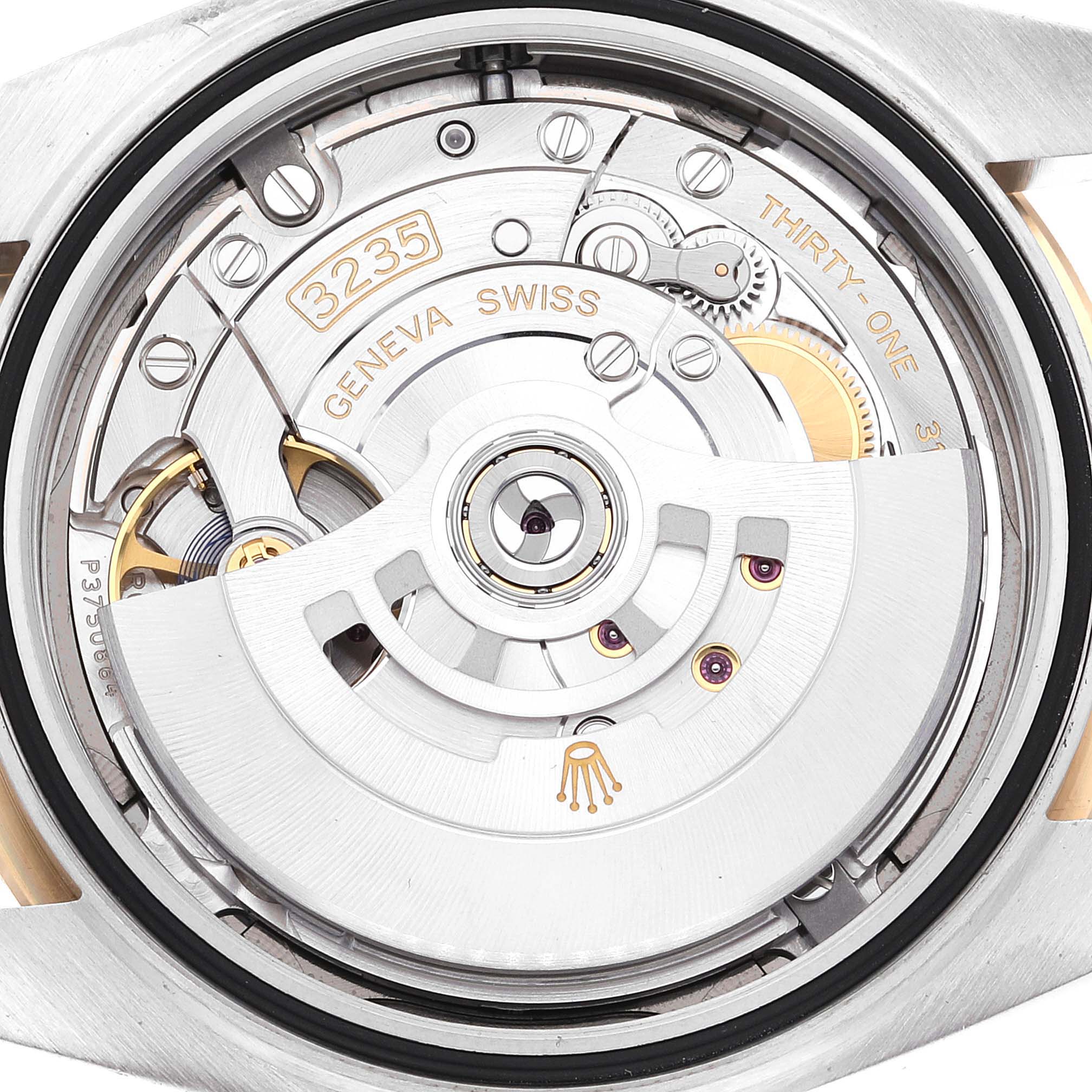 This image shows the intricate movement and mechanism of the Rolex Datejust 41 126333 Men's Steel and Gold (two tone) Grey Dial 126333 Men's Steel and Gold (two tone) Grey Dial model from a rear view.
