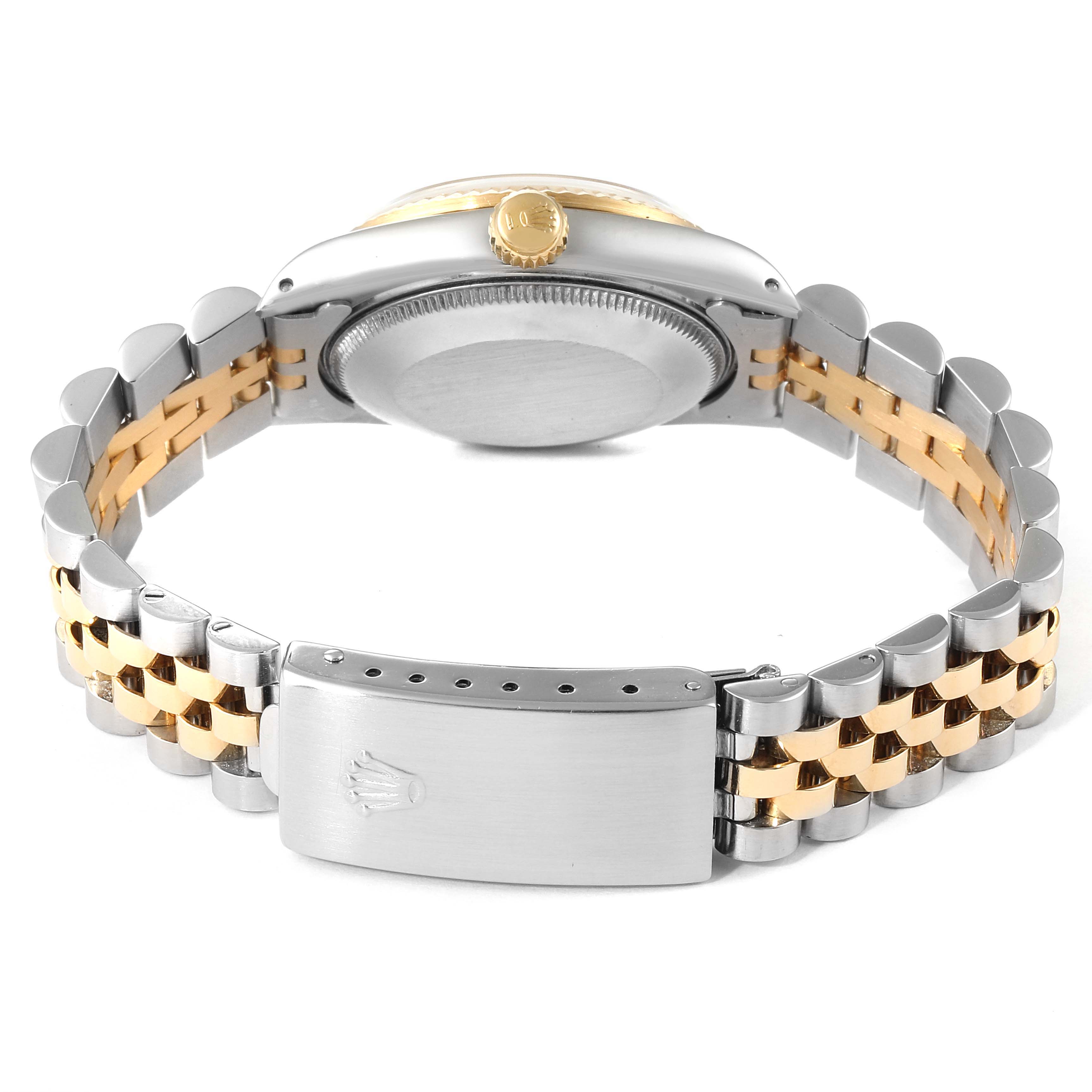The image shows the back of a Rolex Mid-Size 68273 Women's Steel and Gold (two tone) Champagne Dial 68273 Women's Steel and Gold (two tone) Champagne Dial watch and its two-tone bracelet clasp.