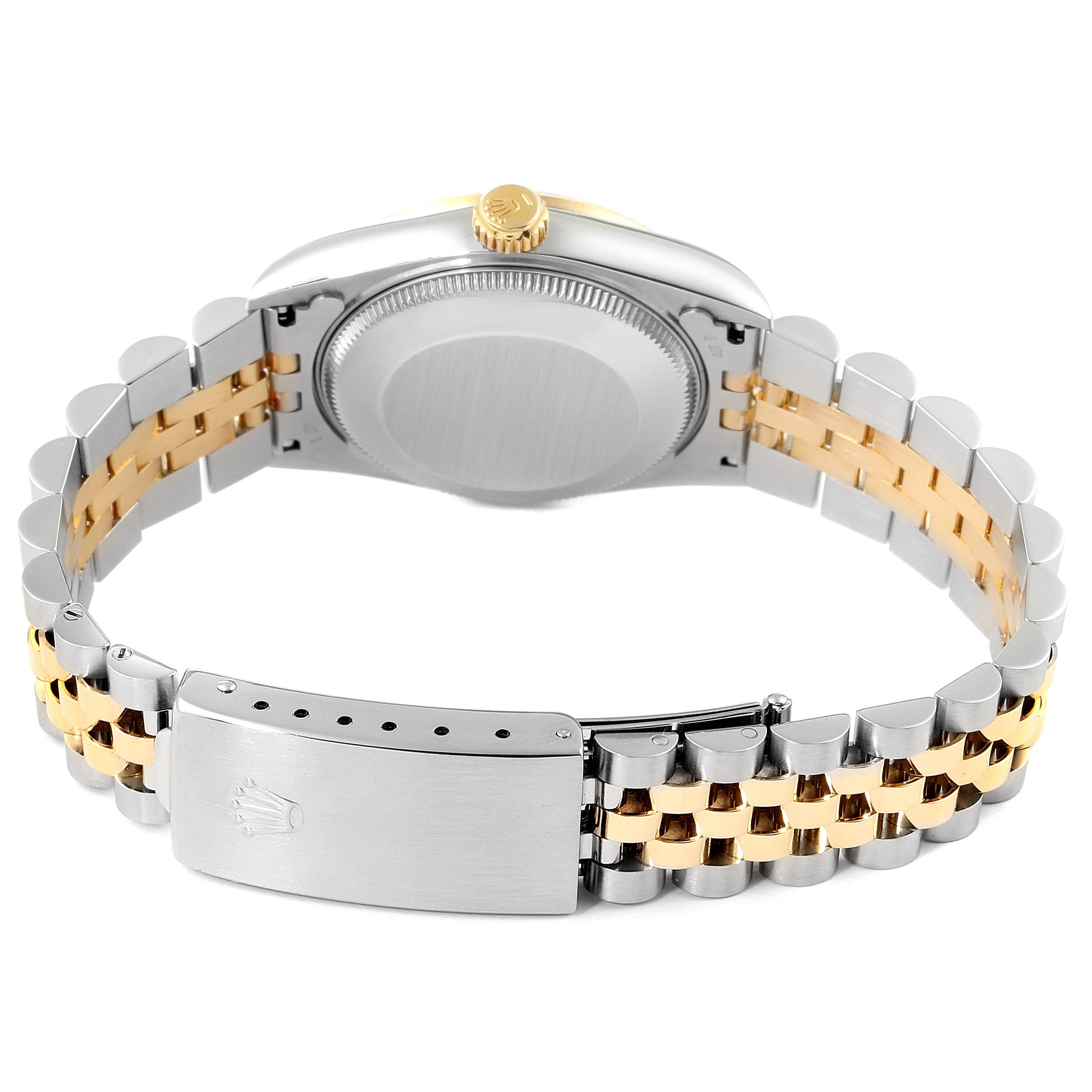 The image shows the back view of a Rolex Mid-Size 68273 Women's Steel and Gold (two tone) Champagne Dial 68273 Women's Steel and Gold (two tone) Champagne Dial model, highlighting the case back, two-tone bracelet, and clasp.