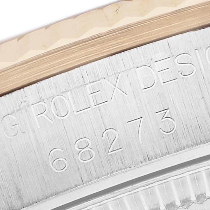 The image shows a close-up of the engraved inner casing of a Rolex Datejust 68273 Women's Stainless Steel Black Dial watch, featuring the model number.