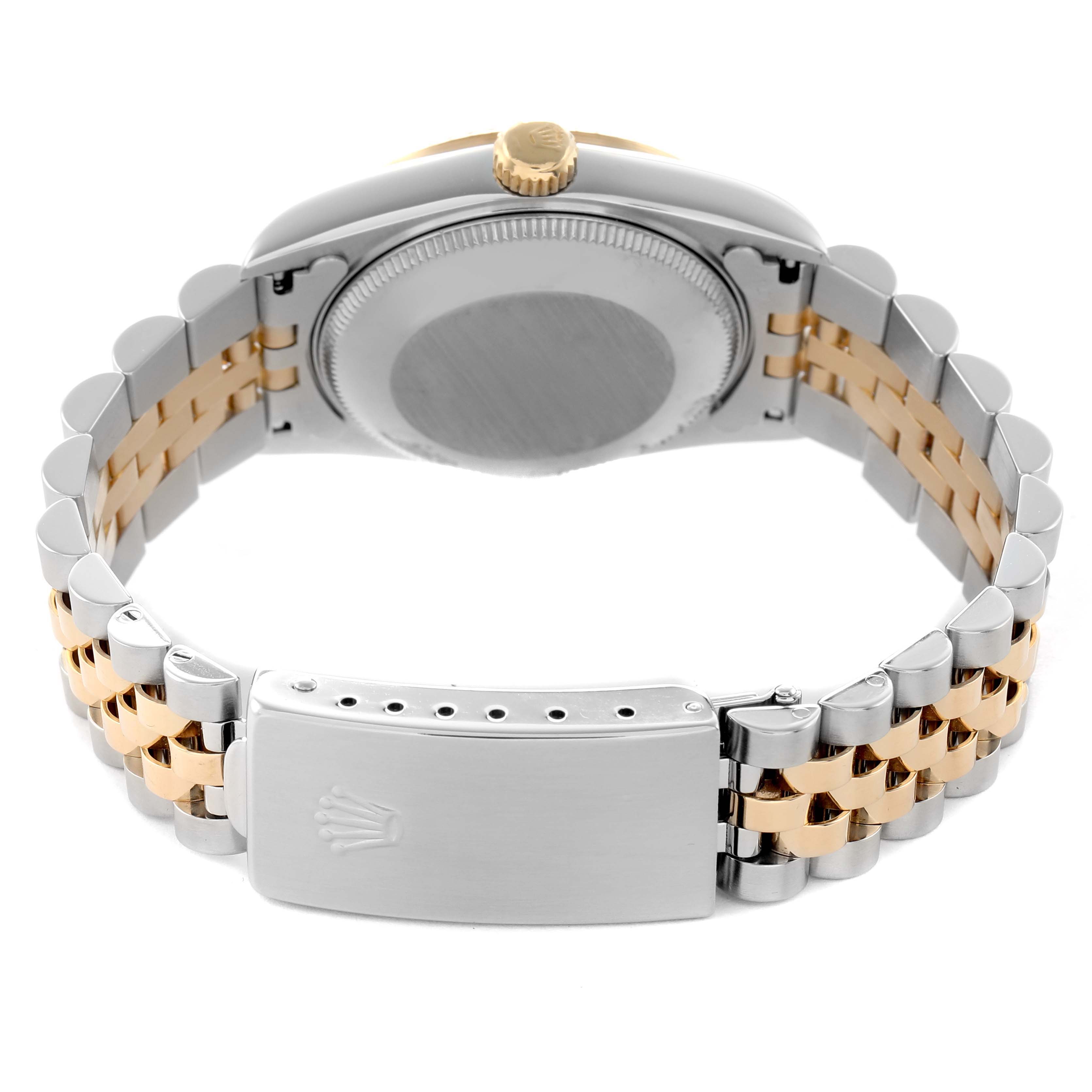 The image shows the back view of a Rolex Datejust 68273 Women's Stainless Steel Black Dial, highlighting the case back, crown, and two-tone bracelet with clasp.