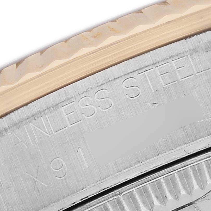 The image shows a close-up of the Rolex Datejust 68273 Women's Stainless Steel Black Dial's stainless steel case with visible engraving details.