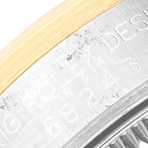 This is a close-up angle showing the engraved side of the bezel of a Mid-Size Rolex watch.