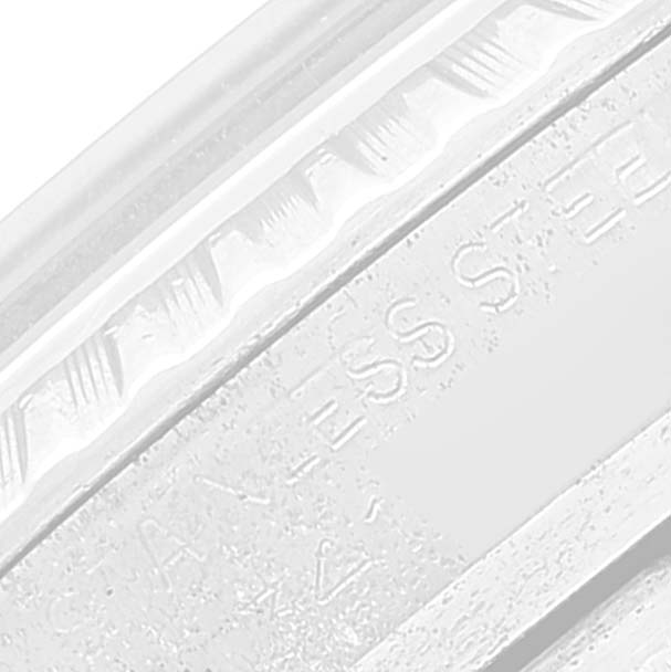 This close-up image shows a part of the bezel and case with engraving on a Rolex Vintage Collection 1603 Men
s Stainless Steel Silver Dial 1603 Men
s Stainless Steel Silver Dial watch.