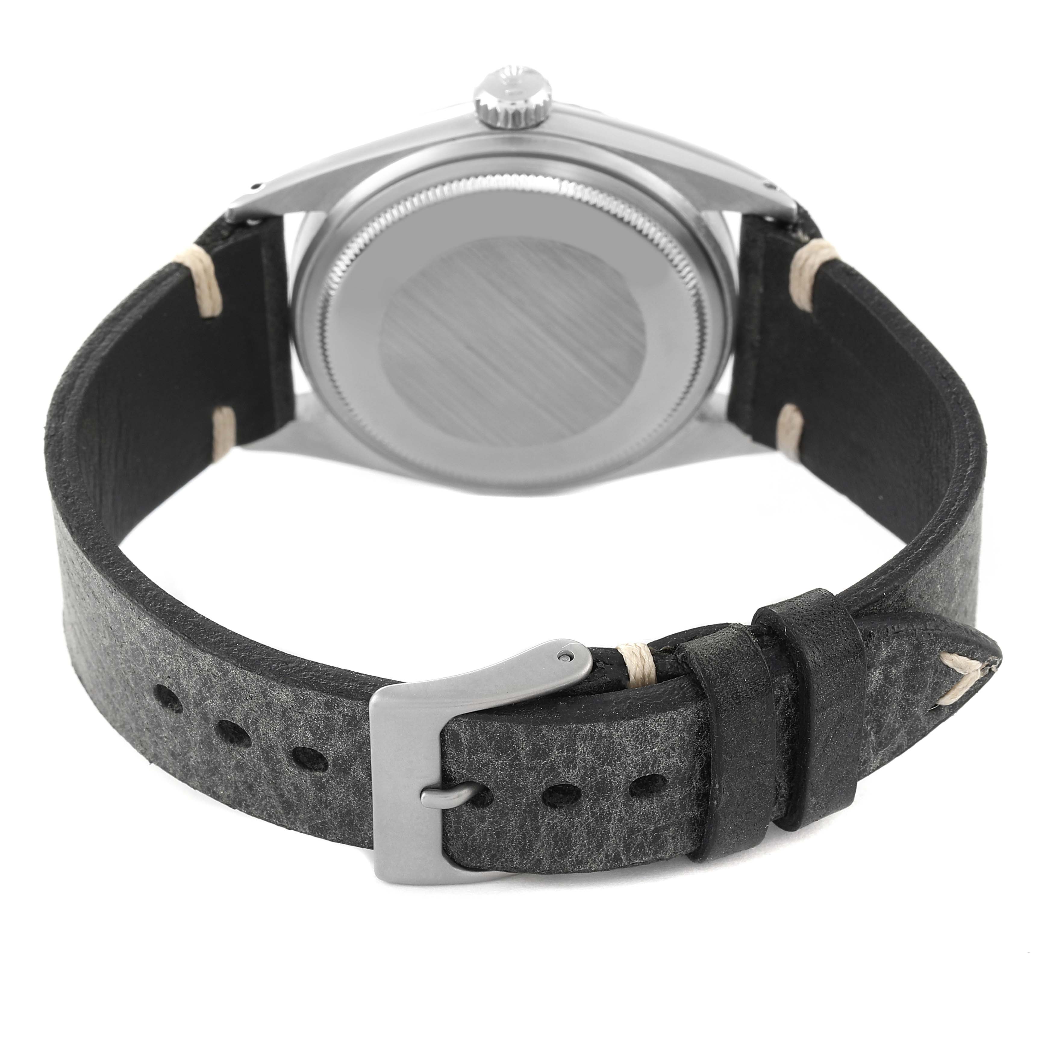 This image shows the back view of a Rolex Vintage Collection 1603 Men
s Stainless Steel Silver Dial 1603 Men
s Stainless Steel Silver Dial watch, highlighting the case back and leather strap with buckle.