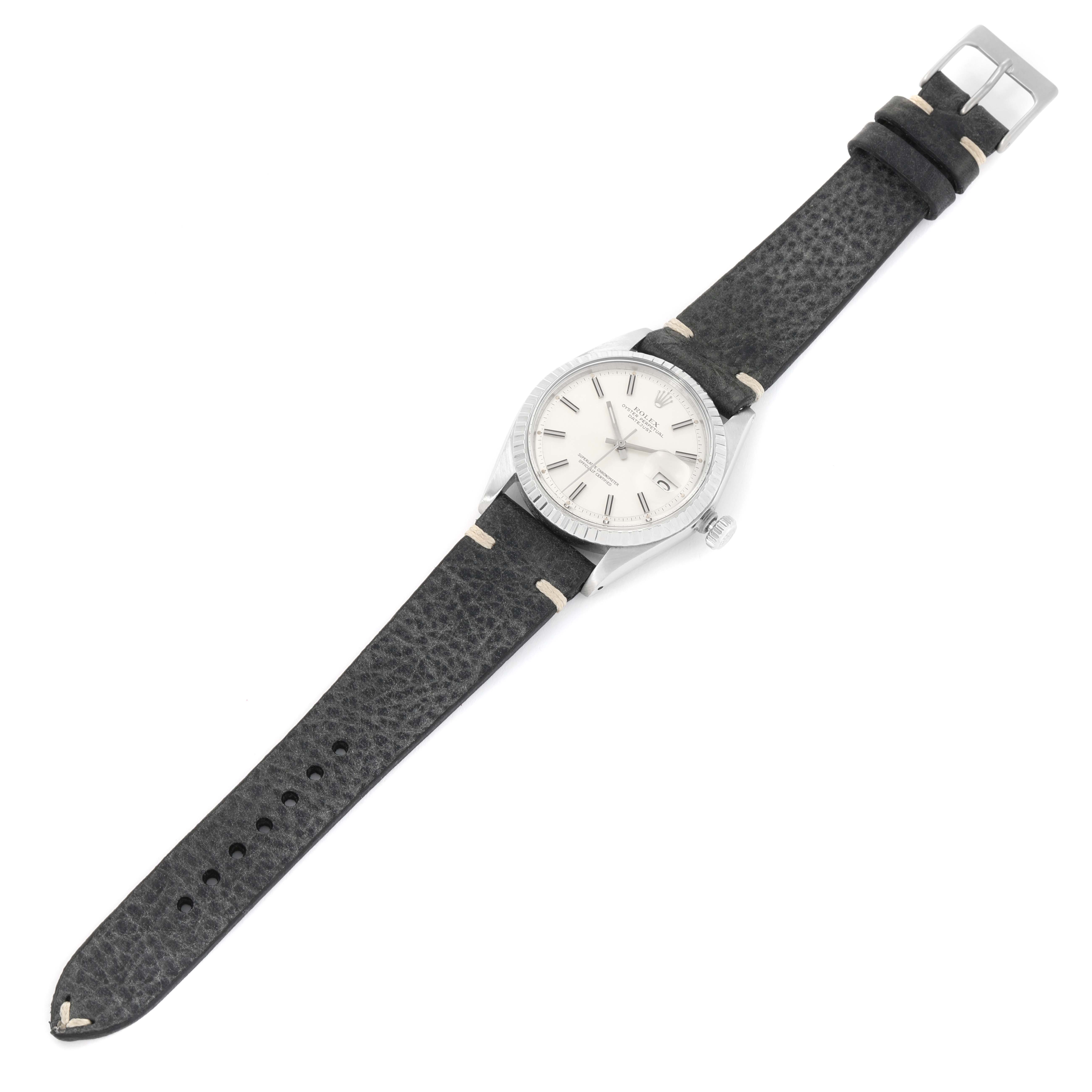 The Rolex Vintage Collection 1603 Men
s Stainless Steel Silver Dial 1603 Men
s Stainless Steel Silver Dial watch is shown from a top-down angle, displaying its face, case, and black leather strap.