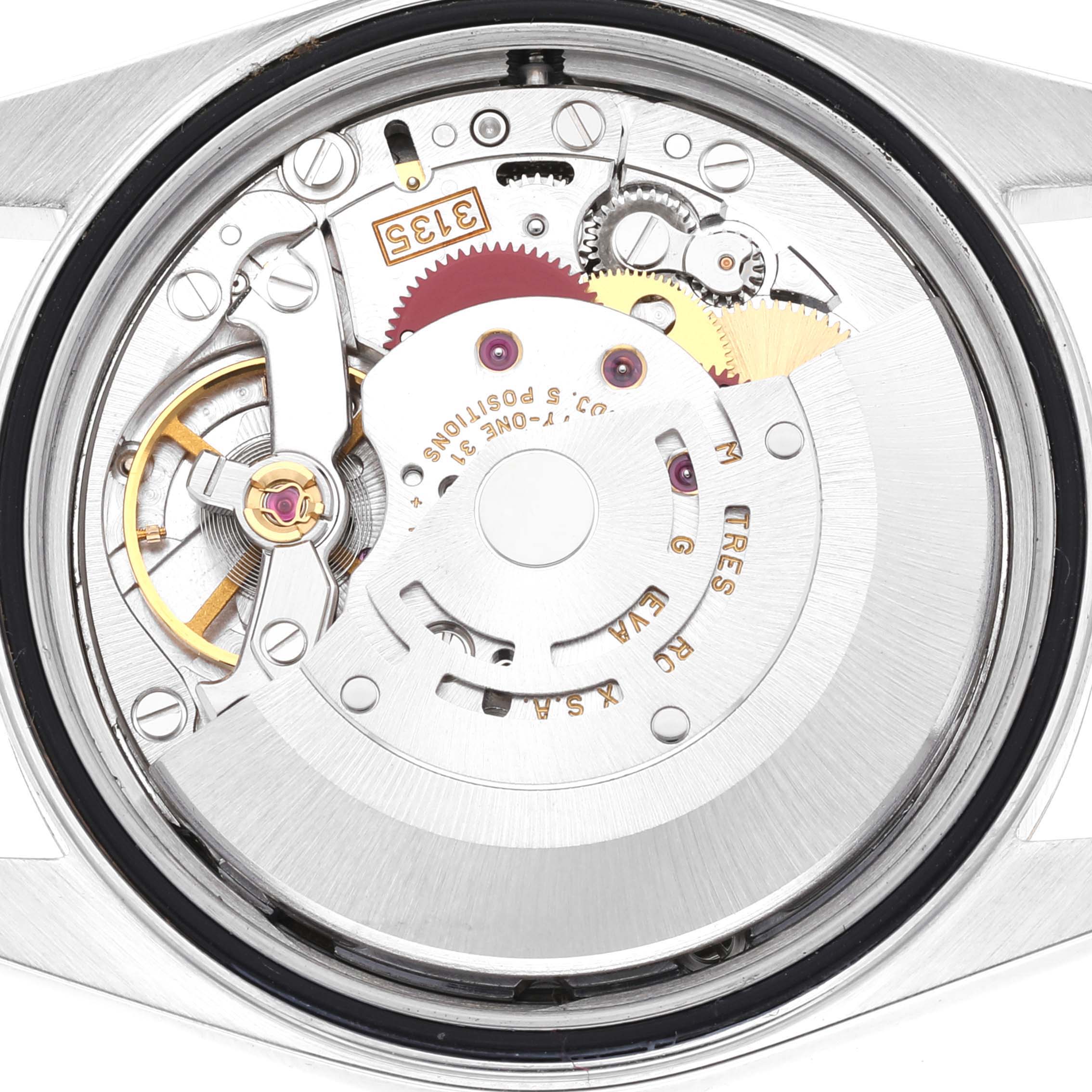 An underside view of the Rolex Datejust 16233 Men's Steel and Gold (two tone) Grey Dial 16233 Men's Steel and Gold (two tone) Grey Dial, showcasing the movement and internal components.